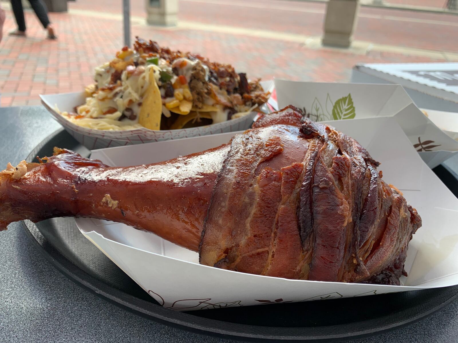 Bacon wrapped turkey leg and pulled pork bacon nachos from Amber Rose was a 2021 Bacon Fest winner. ALEXIS LARSEN/CONTRIBUTOR