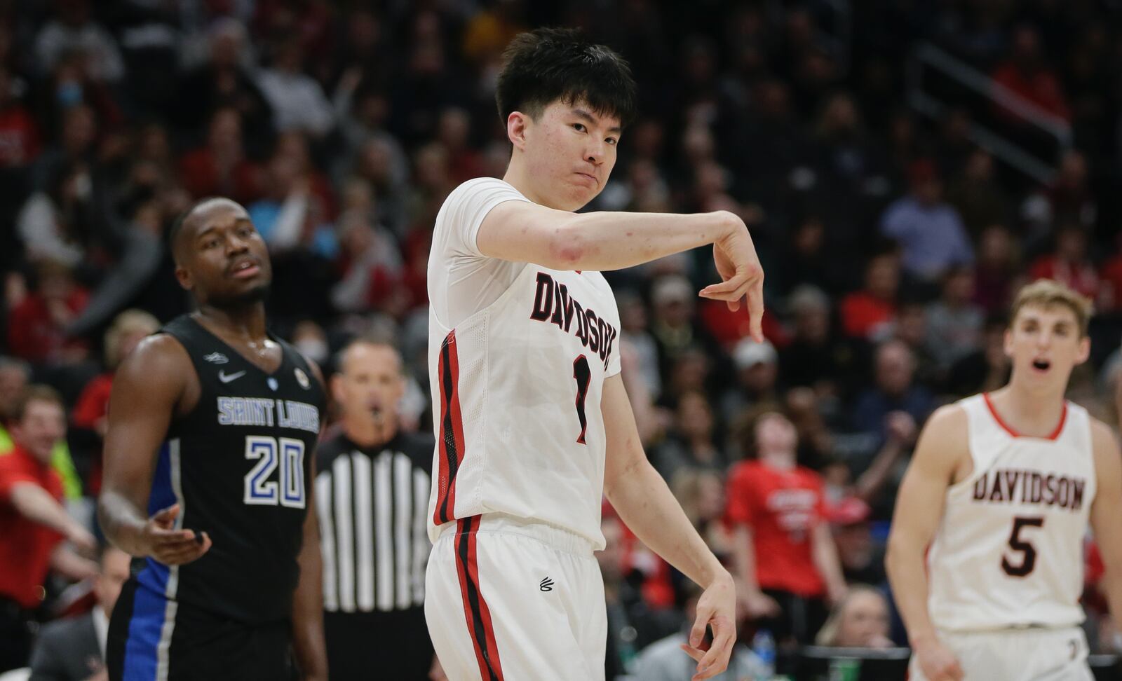 Davidson's Hyunjung Lee reacts after scoring against Saint Louis in the semifinals of the Atlantic 10 Conference tournament on Saturday, March 12, 2022, at Capital One Arena in Washington, D.C. David Jablonski/Staff