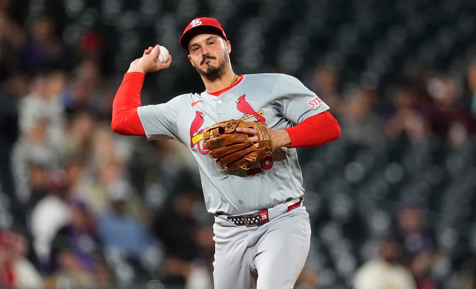 FILE - St. Louis Cardinals third baseman Nolan Arenado throws to first base in the ninth inning of a baseball game Sept. 25, 2024, in Denver. (AP Photo/David Zalubowski, File)