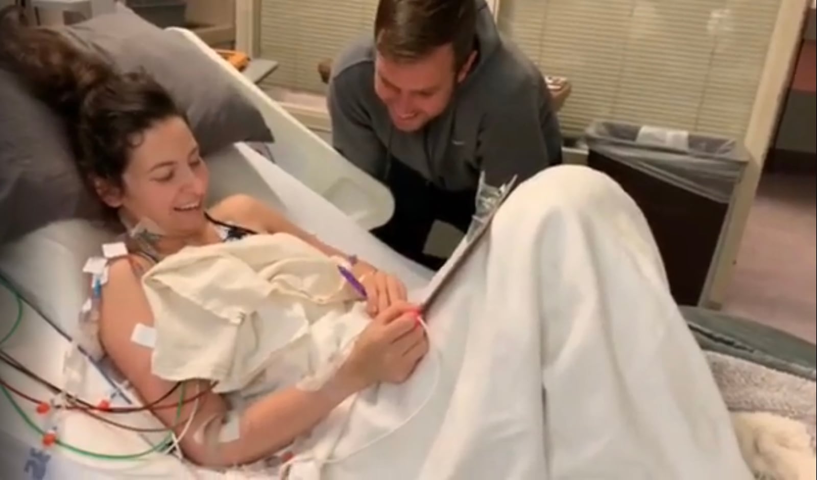 In 2018, 30-year-old Jeri Ward suffered a massive stroke that almost took her life. Completely incapacitated, she had to learn to read, write, eat and walk again. She is shown in the ICU with her husband, Dean, after several brain surgeries to remove blood clots. CONTRIBUTED