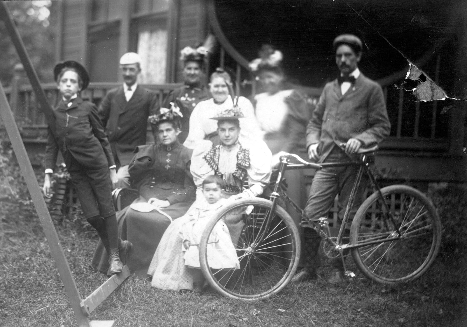 Friends and family pose for a photograph with a bicycle in 1895 at the Best Cottage in Dayton. The cottage was located at Idlewyld, the Best estate that later became Triangle Park. DAYTON METRO LIBRARY / LUTZENBERGER PICTURE COLLECTION