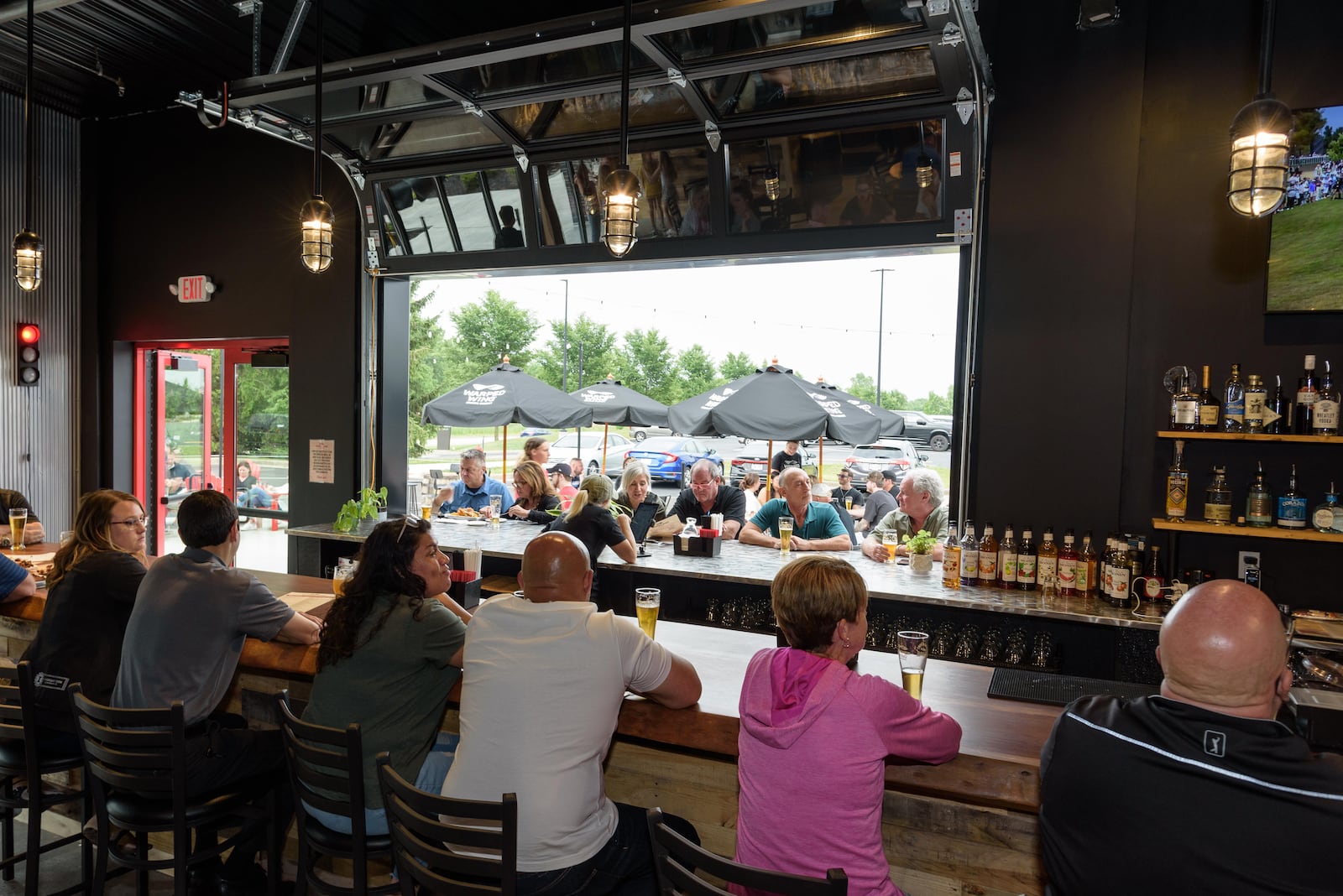 The new Warped Wing Brewery & Smokery, located at 6602 Executive Boulevard in Huber Heights next to the Rose Music Center at The Heights, celebrated its grand opening on Friday, June 16, 2023. TOM GILLIAM / CONTRIBUTING PHOTOGRAPHER