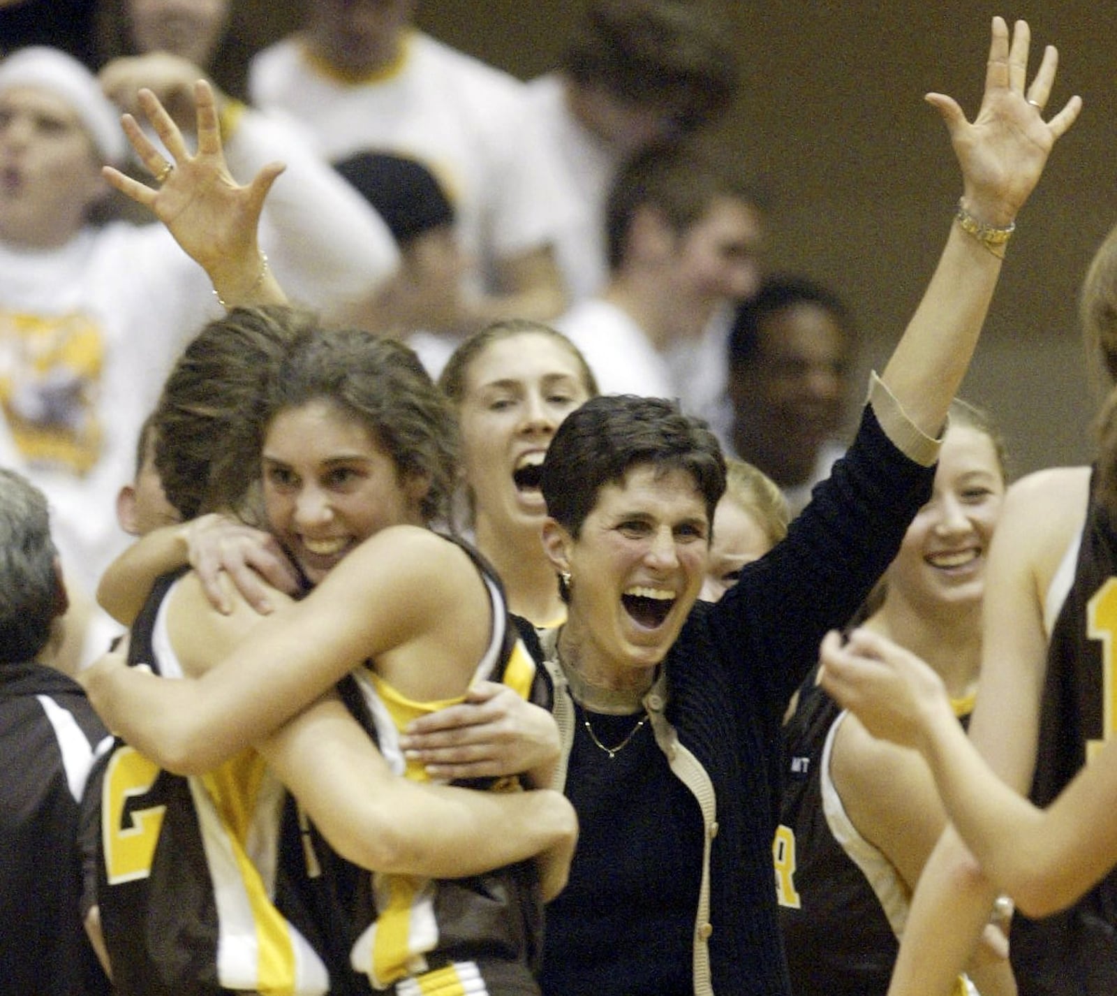 Alter Co-Head Coach Christina Hart celebrates with her team after knocking off Tippecanoe in overtime of their Division II regional final Friday, March 13, 2009, at Vandalia. DDN FILE