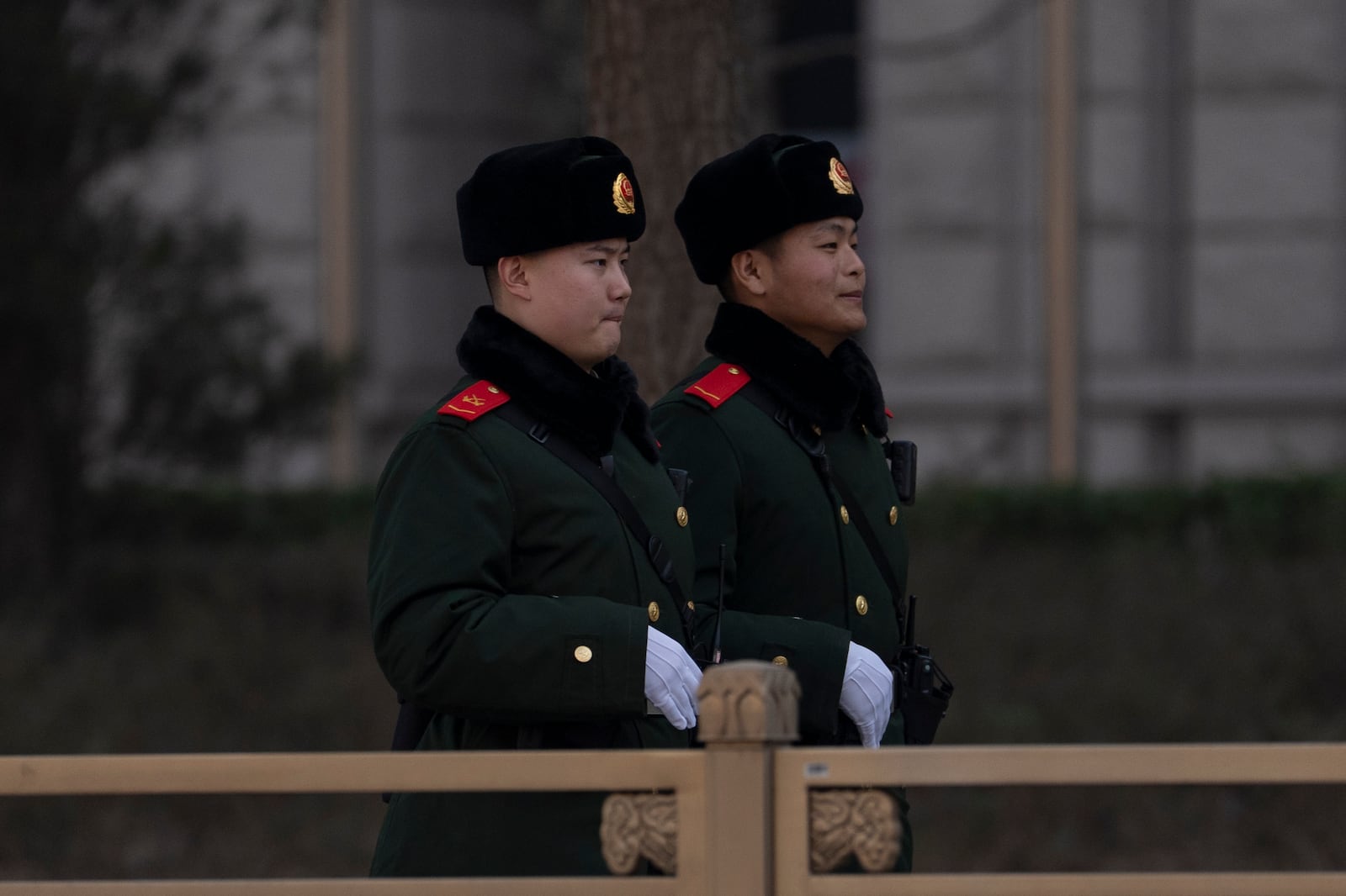 Chinese paramilitary policemen patrol the streets near the Great Hall of the People ahead of the National People's Congress in Beijing, on Feb. 28, 2025. (AP Photo/Ng Han Guan)