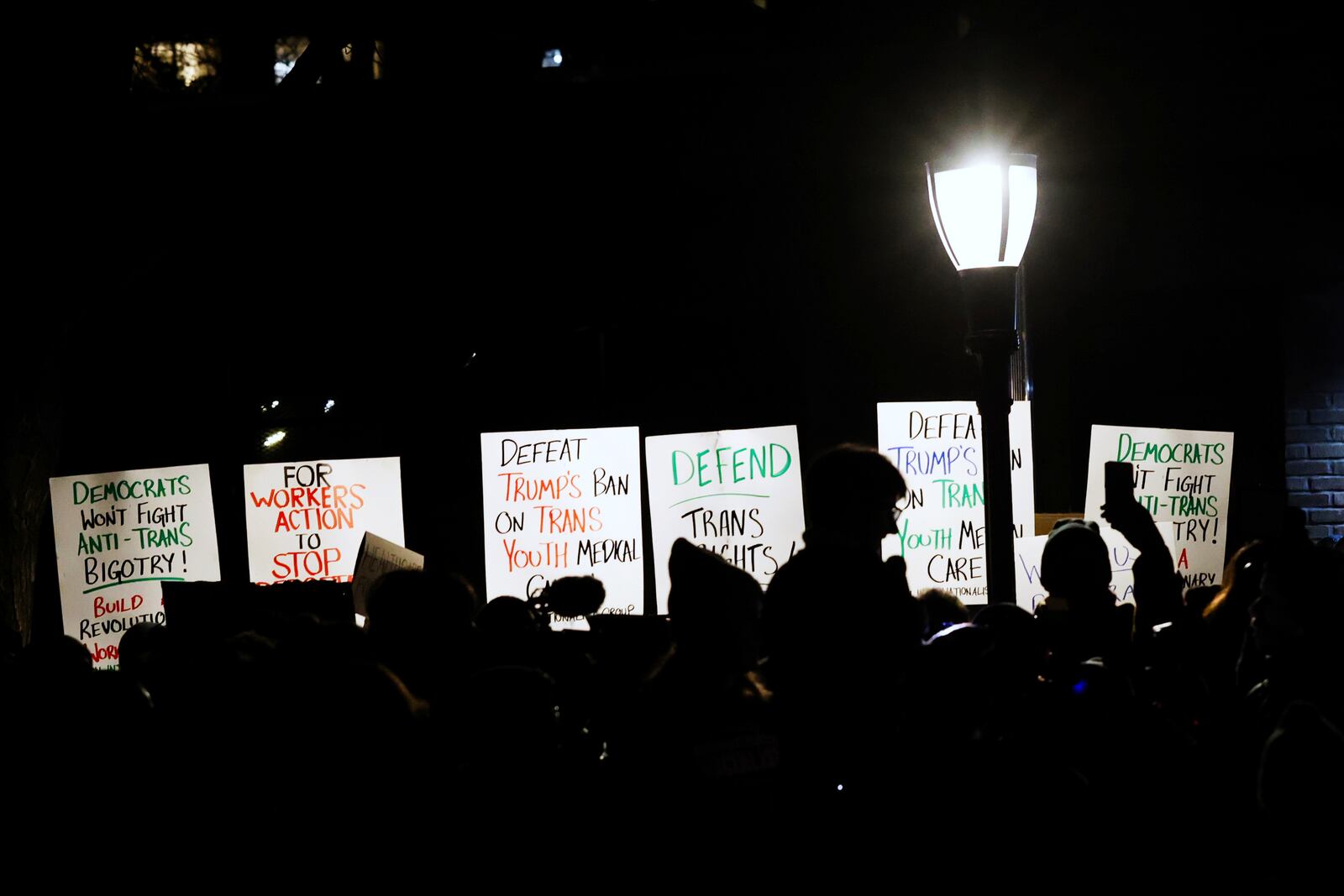 People gather for a rally demanding that NYU Langone commit to providing health care for transgender youth following an executive order by President Donald Trump aimed at cutting federal funding for gender-affirming care, Monday, Feb. 3, 2025, in New York. (AP Photo/Heather Khalifa)