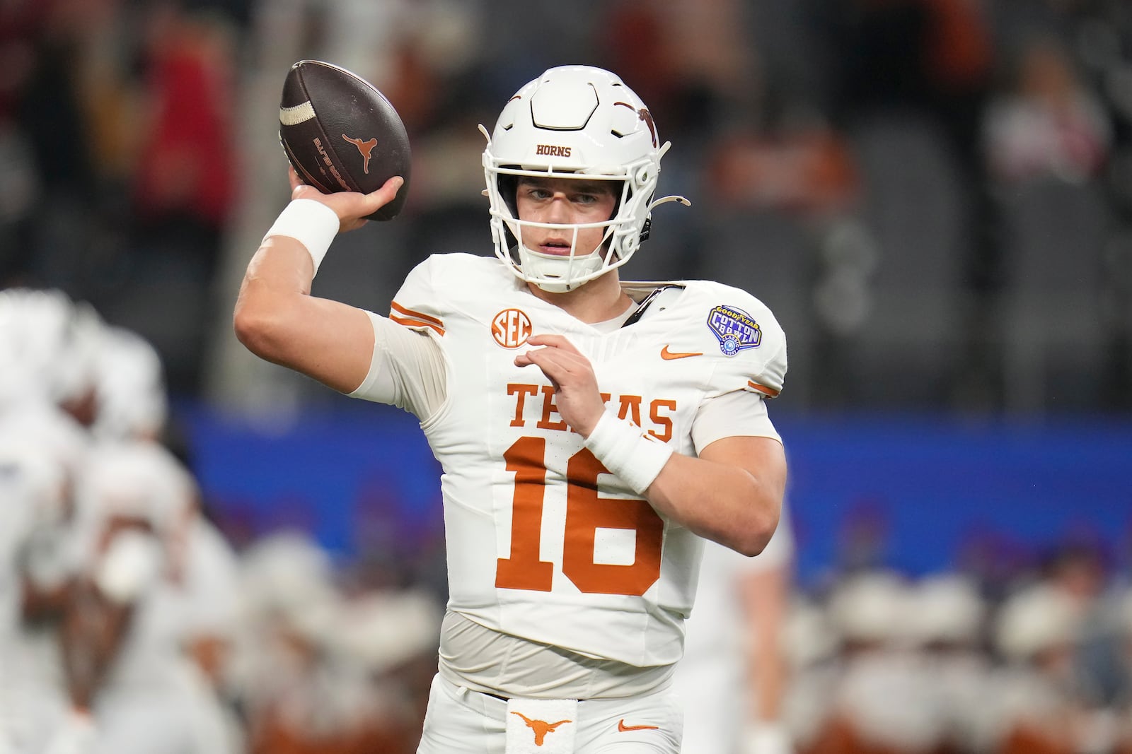 Texas quarterback Arch Manning warms up before the Cotton Bowl College Football Playoff semifinal game against Ohio State, Friday, Jan. 10, 2025, in Arlington, Texas. (AP Photo/Julio Cortez)