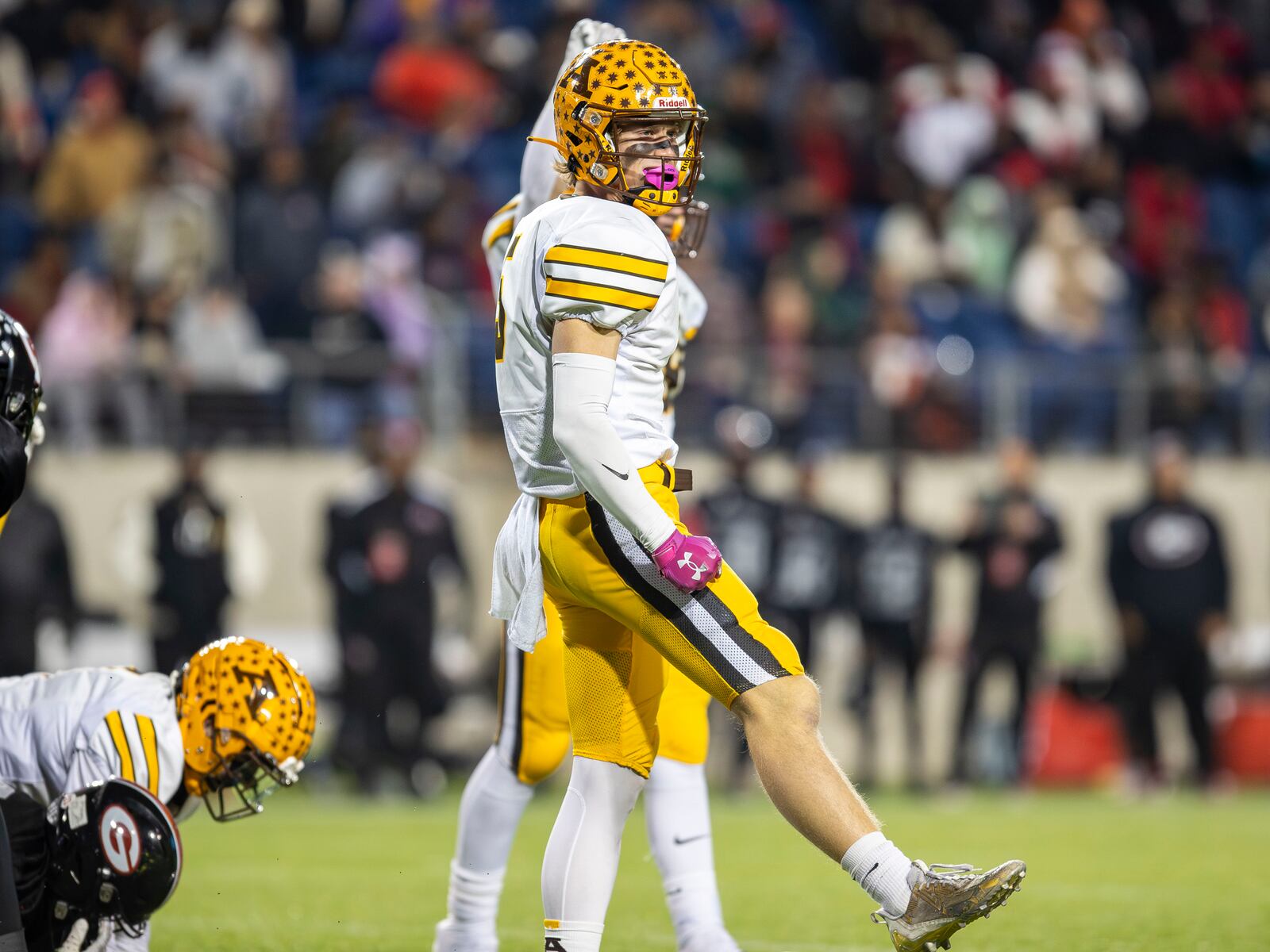 Alter High School senior Michael Russ celebrates after a making a key stop during the Division IV state championship game against Cleveland Glenville on Saturday night at Tom Benson Hall of Fame Stadium in Canton. CONTRIBUTED PHOTO BY MICHAEL COOPER