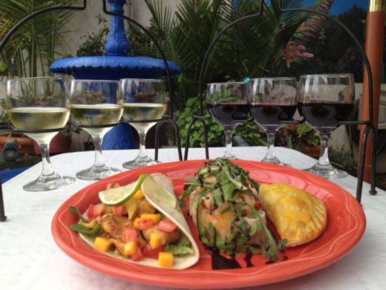 Food on El Meson’s patio (Facebook).