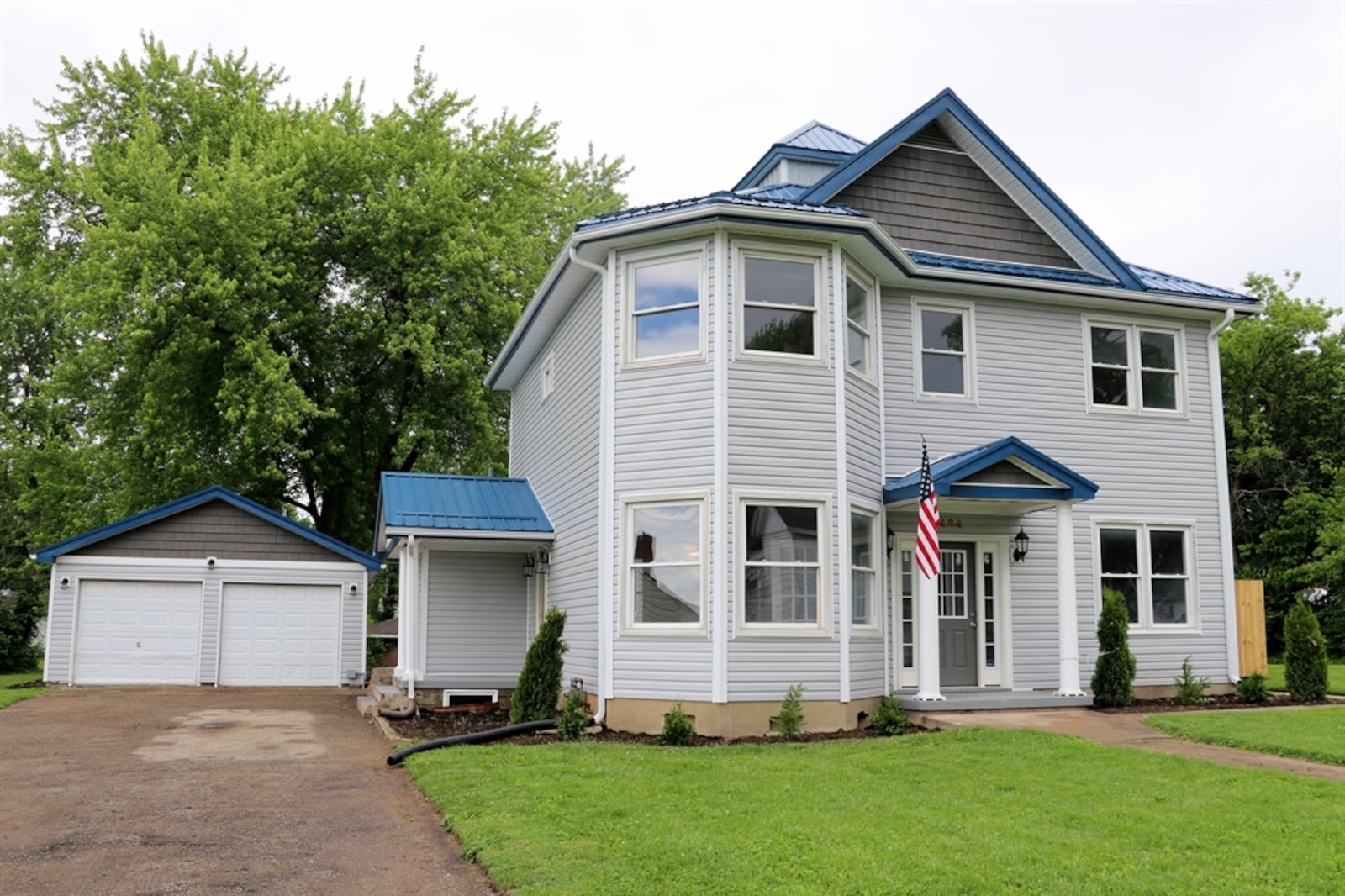 The half-acre property includes a two-car detached garage, two concrete patios and a front driveway to the garage.  Contributed photo 