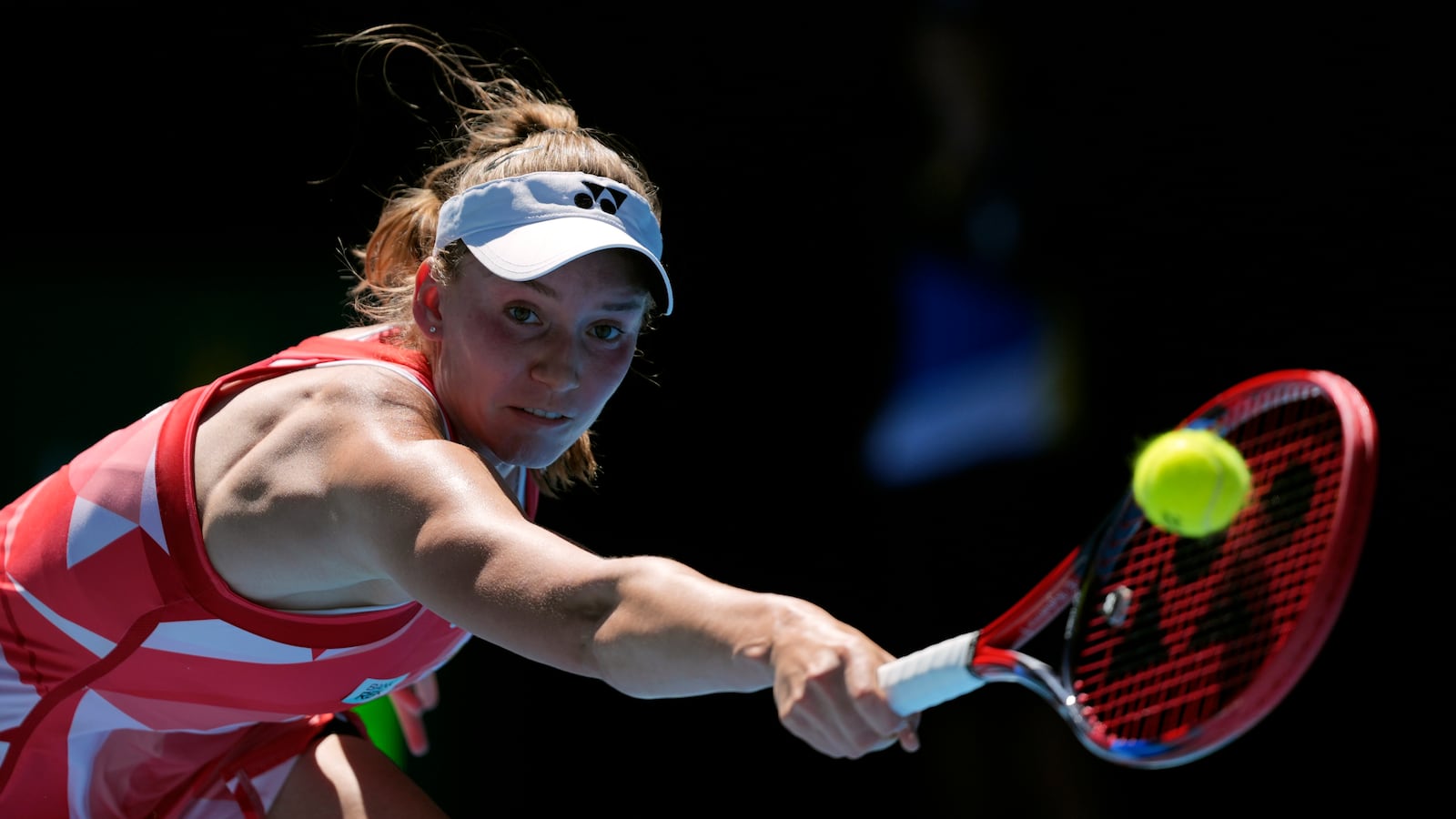 Elena Rybakina of Kazakhstan plays a backhand return to Dayana Yastremska of Ukraine during their third round match at the Australian Open tennis championship in Melbourne, Australia, Saturday, Jan. 18, 2025. (AP Photo/Ng Han Guan)