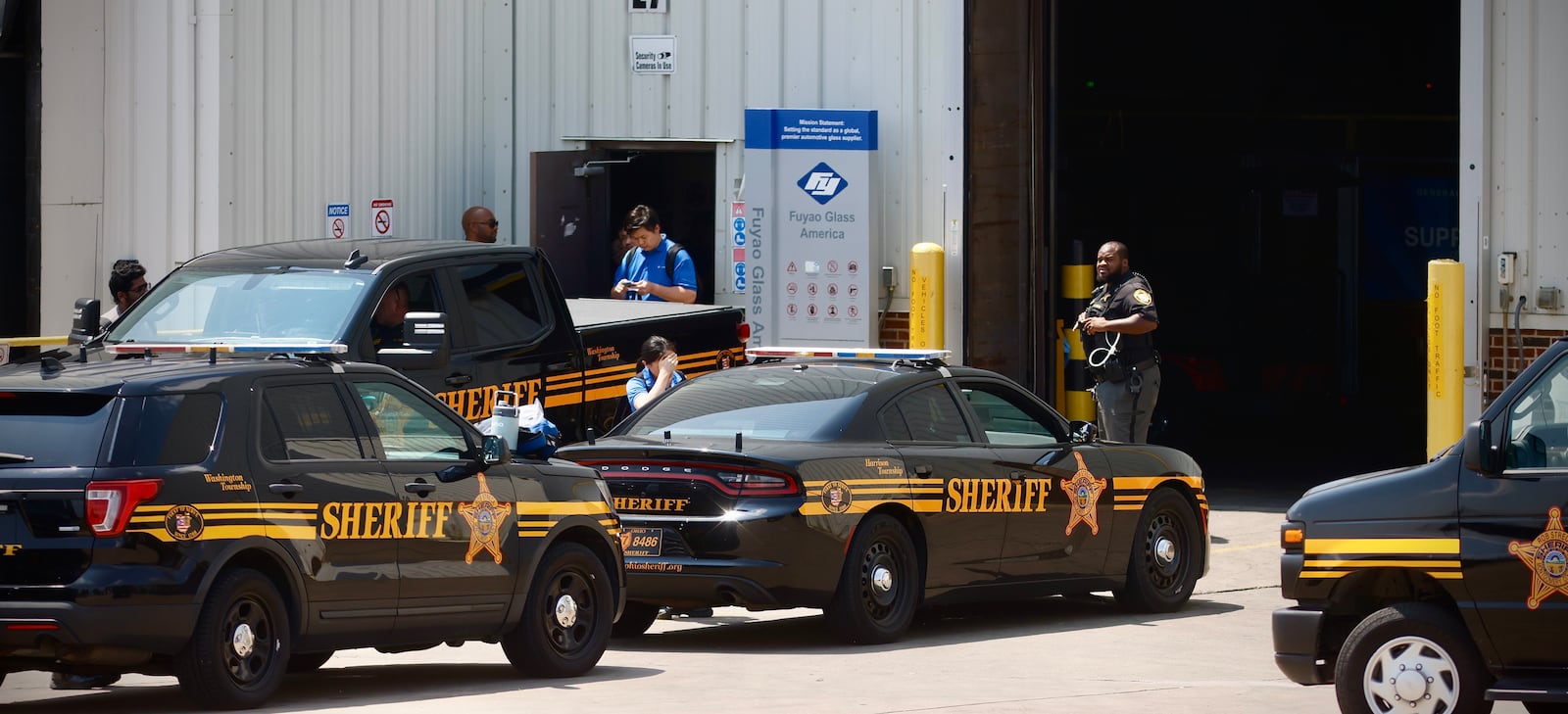 Several Montgomery County Sheriff's Office cruisers were staged outside Fuyao Glass America in Moraine Friday, July 26, 2024. MARSHALL GORBY \STAFF