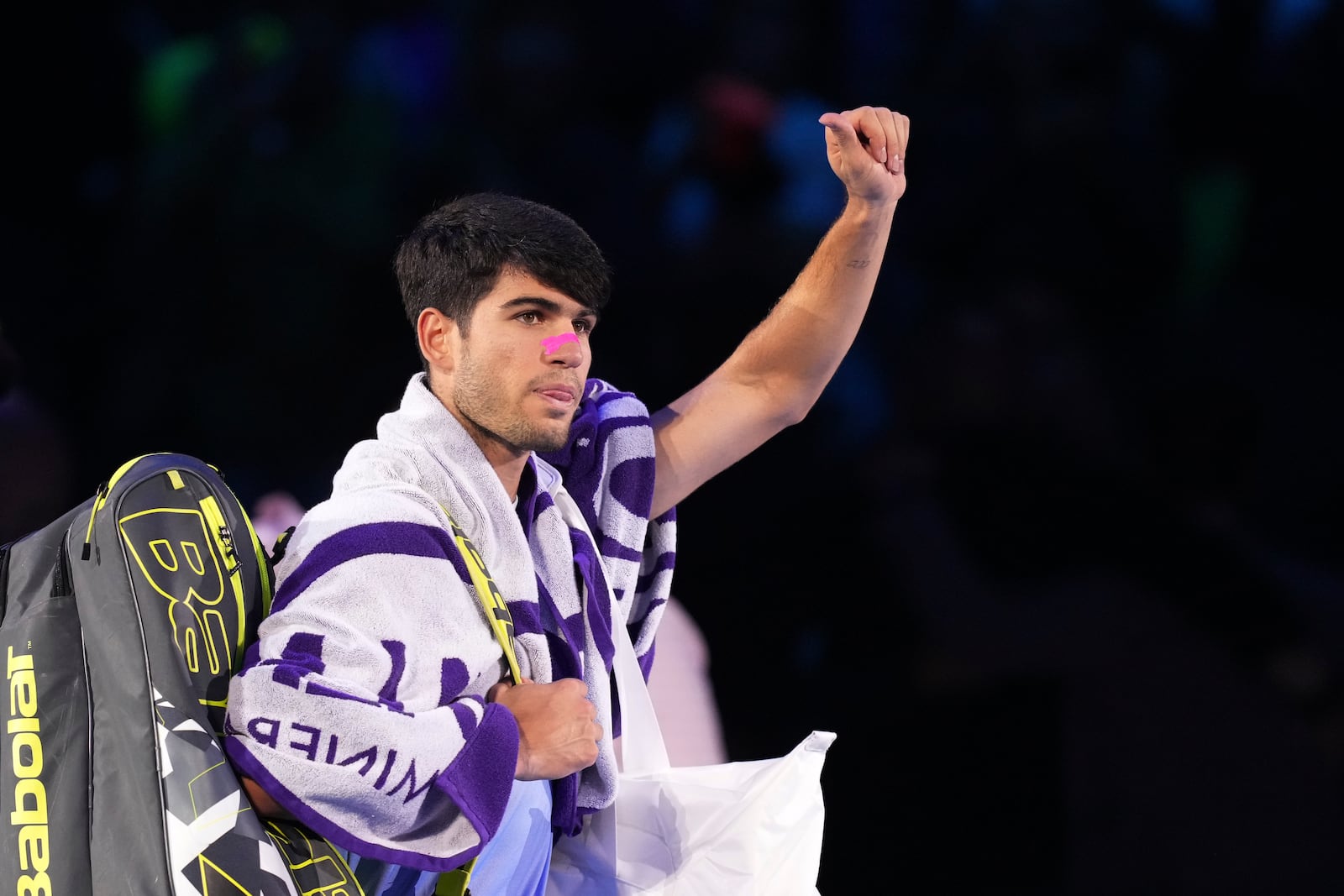 Spain's Carlos Alcaraz leaves the pitch at the end of the singles tennis match of the ATP World Tour Finals against Germany's Alexander Zverev, at the Inalpi Arena, in Turin, Italy, Friday, Nov. 15, 2024. (AP Photo/Antonio Calanni)