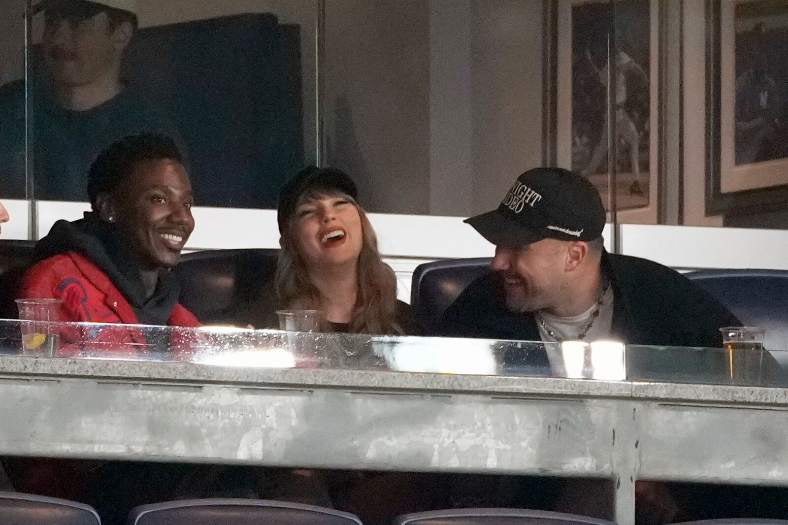 Travis Kelce, right, and Taylor Swift attend Game 1 of the baseball AL Championship Series between the Cleveland Guardians and New York Yankees Monday, Oct. 14, 2024, in New York. (AP Photo/Seth Wenig)