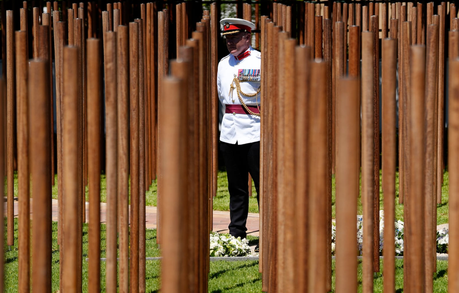 A Royal Marine officer attends the opening of a memorial dedicated to more than 1,700 Black South African servicemen who died in non-combatant roles in World War I and have no known grave, in Cape Town, South Africa, Wednesday, Jan. 22, 2025. (AP Photo/Nardus Engelbrecht)