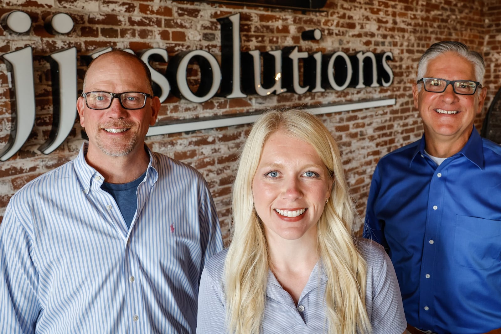 From left, Dave Judson, C.E.O., Carly Cox President & C.O.O. and Dan Marion C.M.O. of JJR Solutions are based in Dayton with offices in Washington D.C. and Colorado Springs. JIM NOELKER/STAFF