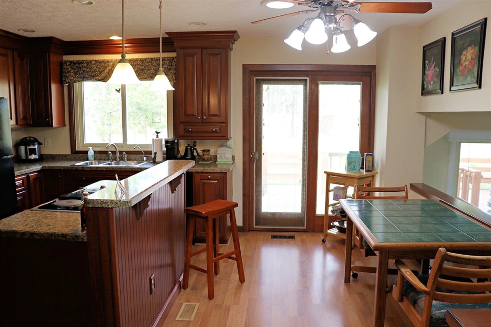 The kitchen comes equipped with a dishwasher and refrigerator. 