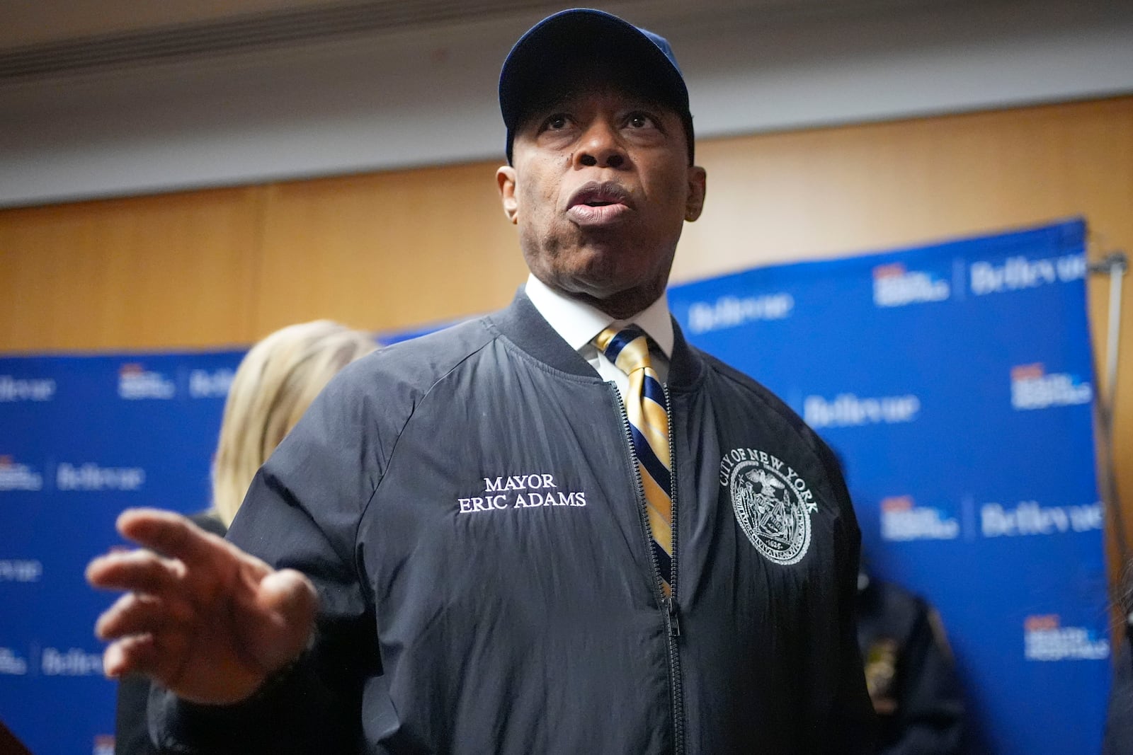 New York City mayor Eric Adams speaks to reporters as he leaves a news conference in New York, Tuesday, Feb. 18, 2025. (AP Photo/Seth Wenig)