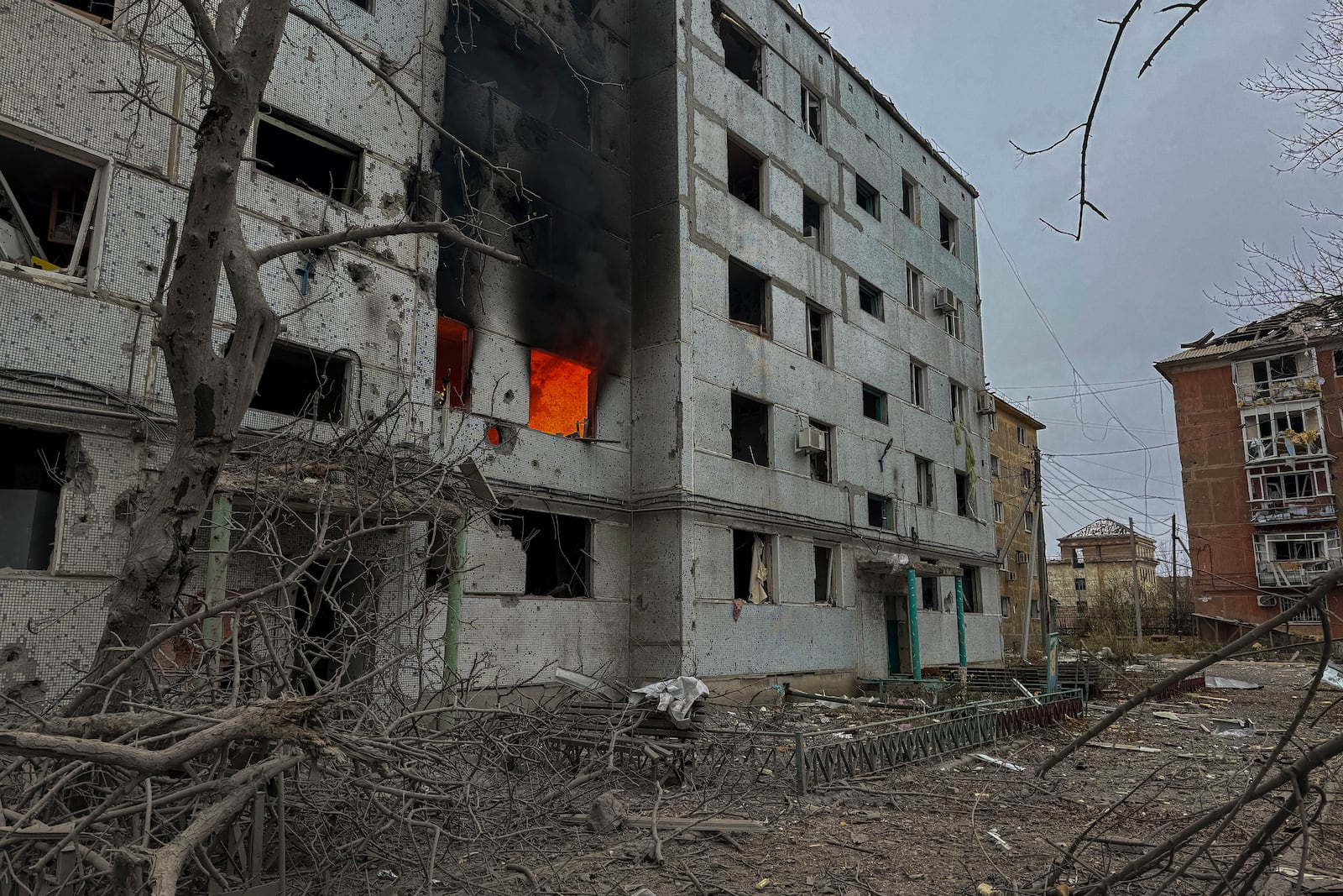 A multi-story building burns after a Russian strike on a residential neighbourhood in Kurakhove, Donetsk region, Ukraine, on Nov. 7, 2024. (AP Photo/Anton Shtuka)