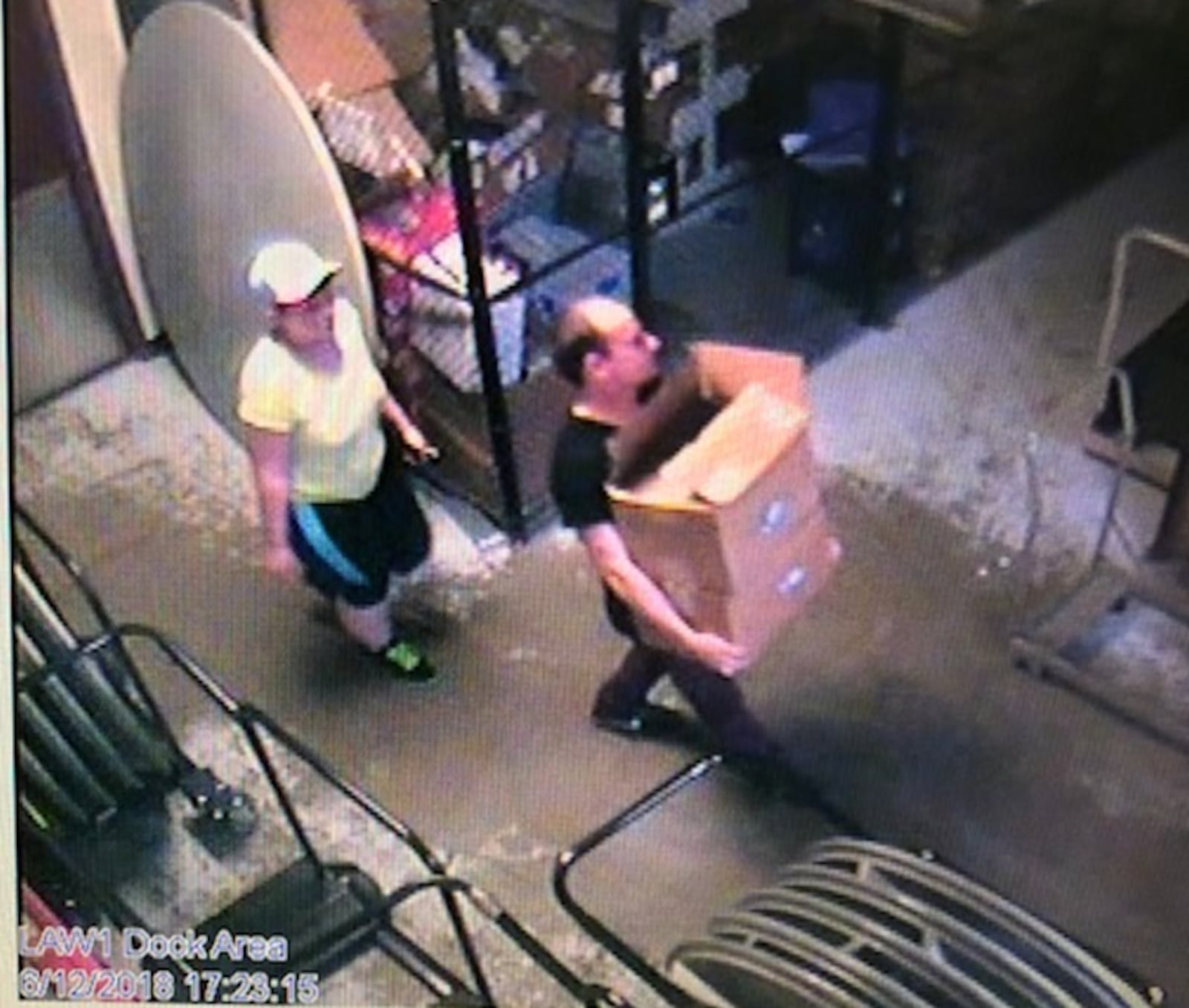 An unknown female suspect seen with the first unknown male, wearing a black shirt. (Contributed photo/Dayton police)