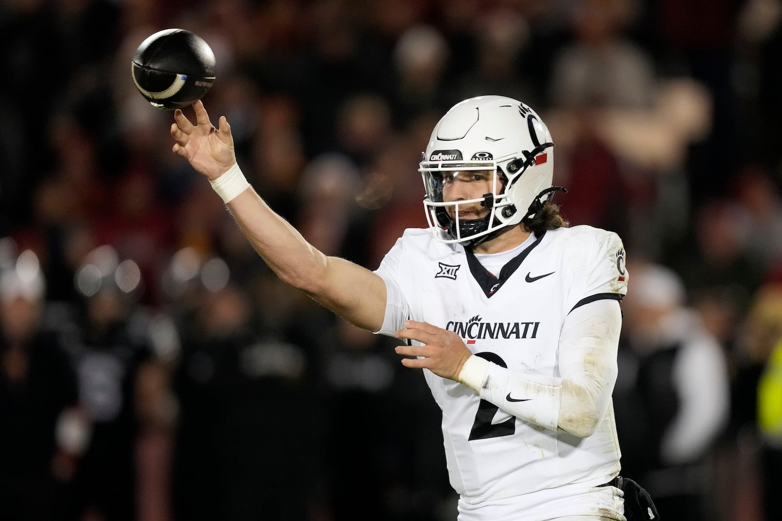 Cincinnati quarterback Brendan Sorsby throws a pass during the second half of an NCAA college football game against Iowa State, Saturday, Nov. 16, 2024, in Ames, Iowa. (AP Photo/Charlie Neibergall)