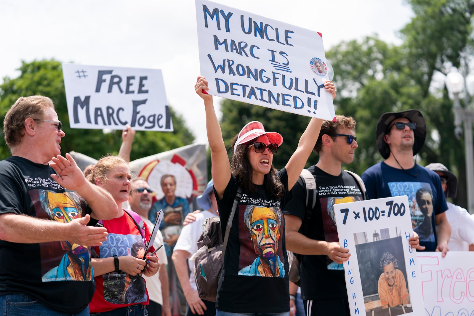 FILE - Ellen Keelan, center, and other family members rally outside the White House for the release of Marc Fogel, who has been detained in Russia since August 2021, July 15, 2023, in Washington. (AP Photo/Stephanie Scarbrough, File)