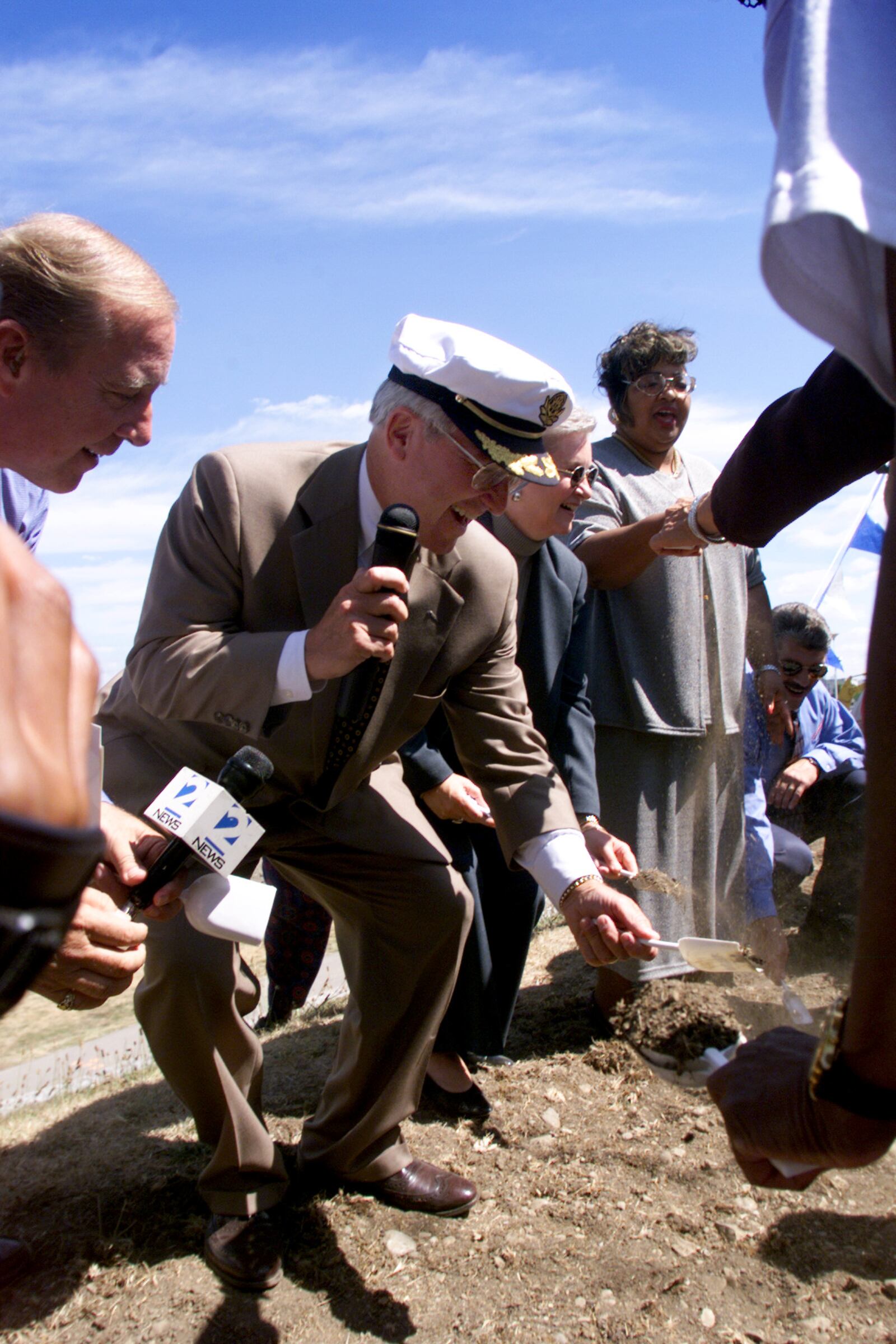 David Holmes turn over a shovel full of dirt to officially break ground for RiverScape on Wednesday. Holmes chaired the project, and it was named Holmes Harbor.