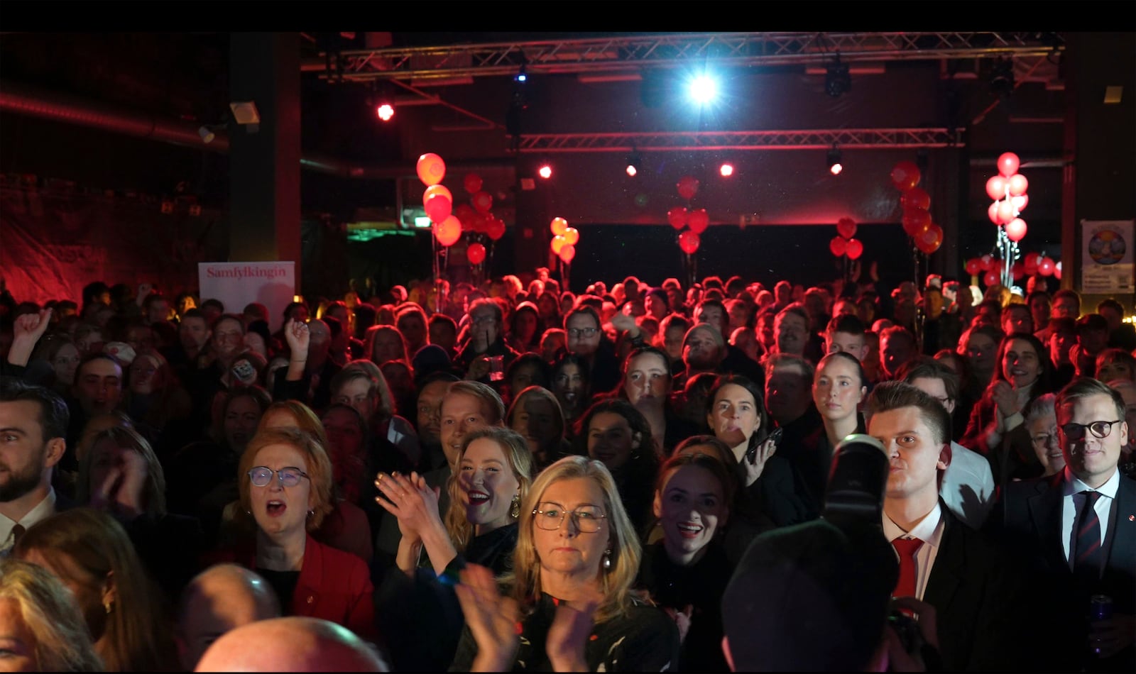 Supporters attend the Samfylkingin Social Democratic Party celebration party following the closure of the polling stations, in Reykjavik, Saturday Nov. 30, 2024. (AP Photo/Marco di Marco)