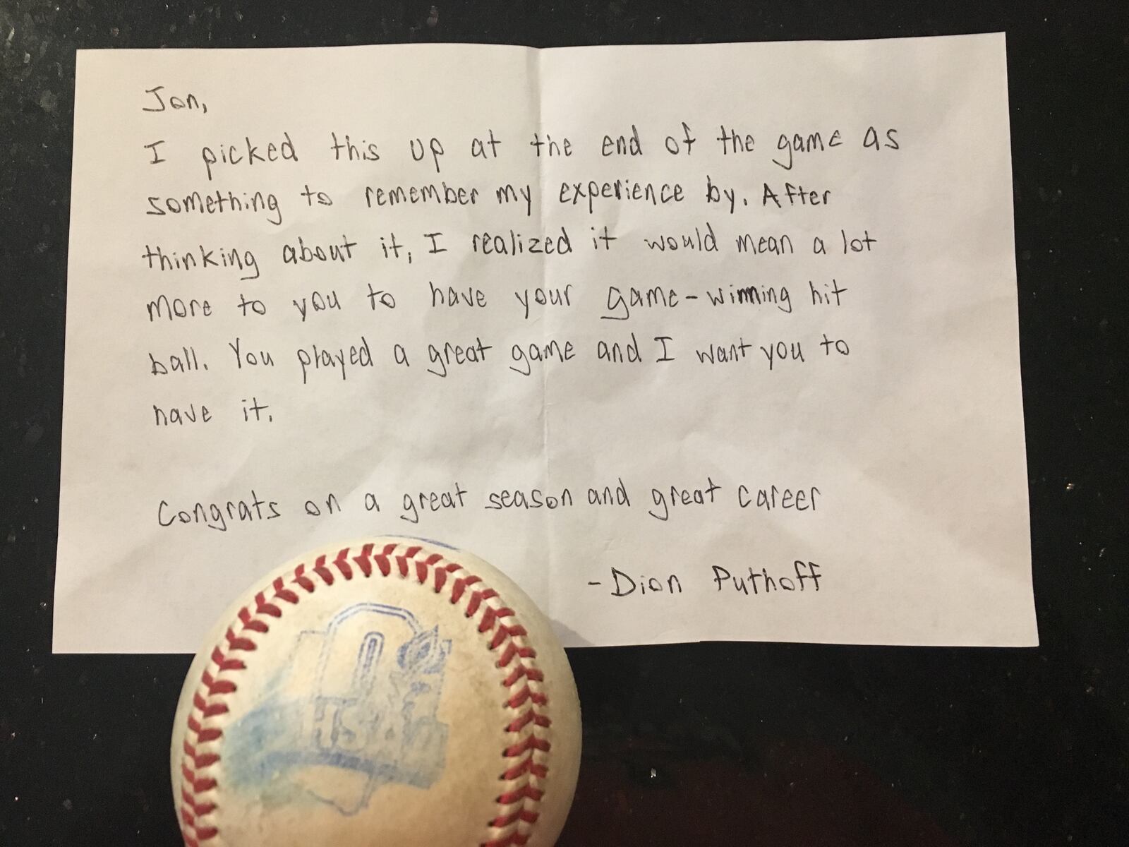 A photo of the ball that Minster's Jon Niemeyer hit to drive in the winning run in the Division IV state championship game on June 3 and a letter by Russia's Dion Puthoff. Photo by Bryan Niemeyer