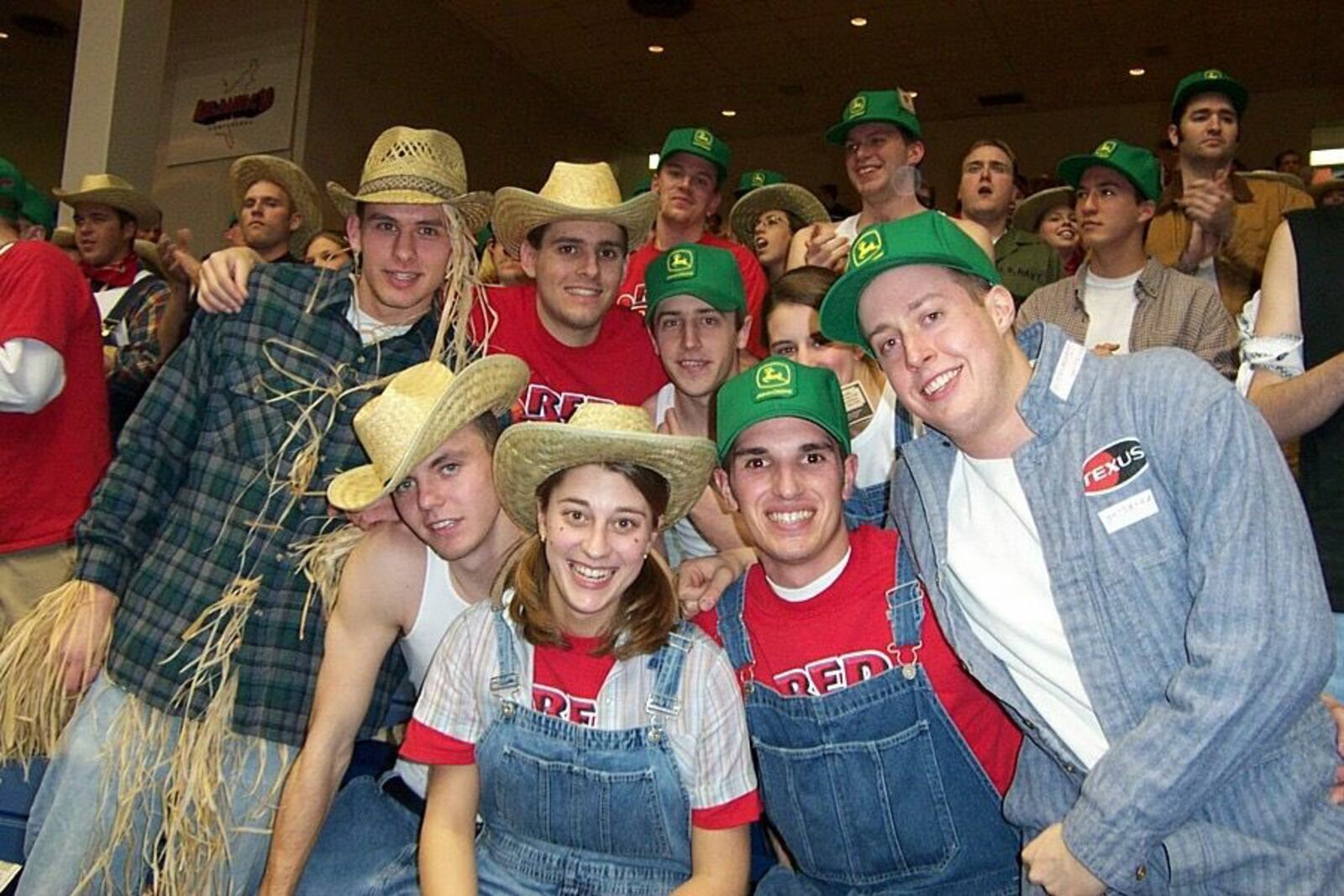 Students in the Red Scare section wear straw hats and John Deere hats before a game against Temple at UD Arena on Feb. 27, 2002. Photo courtesy of Greg Popham II