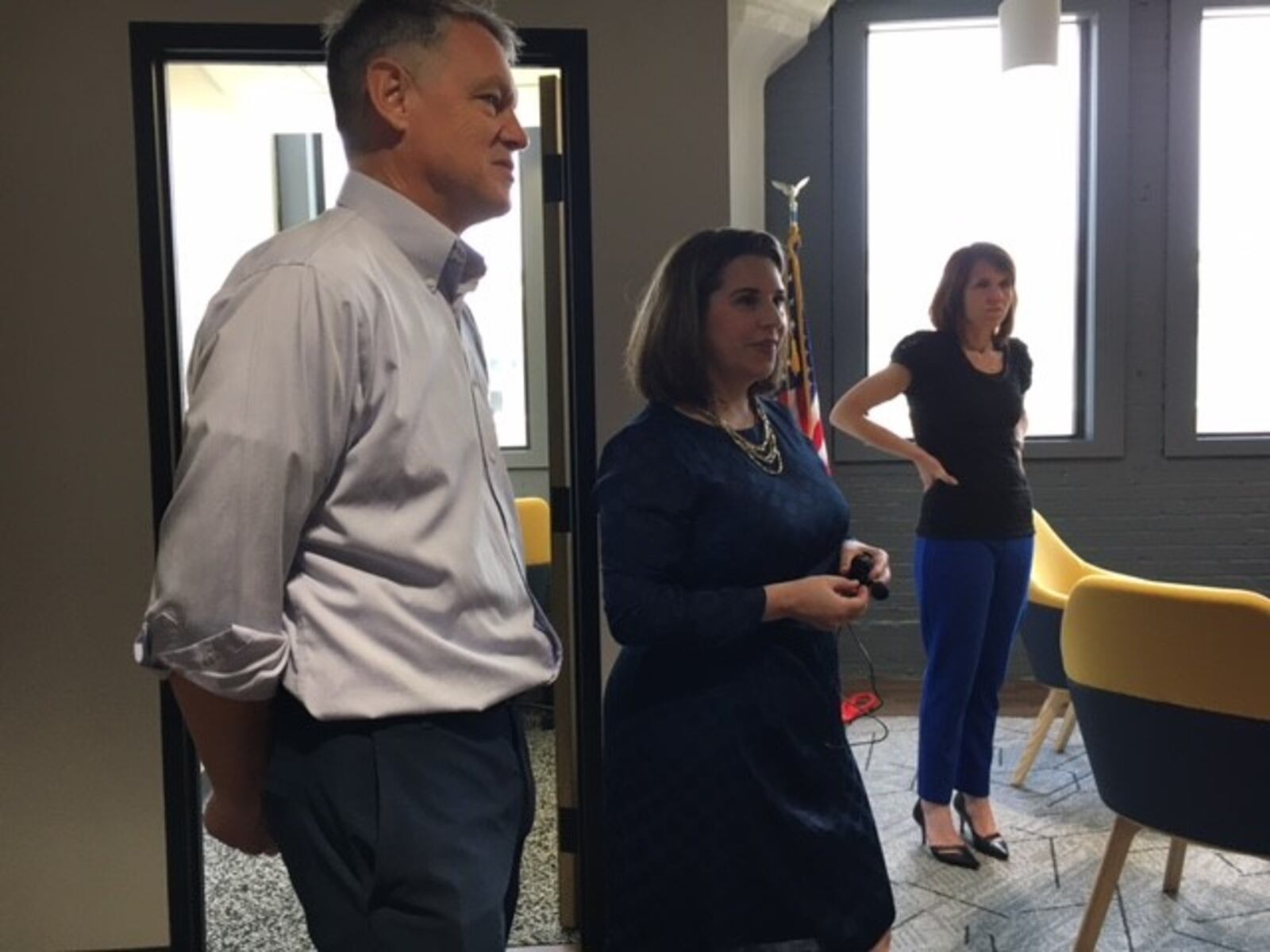 From left: Marty Larson, chief executive of Ascend Innovations. Next to him is Sarah Hackenbracht, CEO of the Greater Dayton Area Hospital Association. Together, they celebrated the opening of their new joint office at 124 E. Third St. Friday June 4. THOMAS GNAU/STAFF