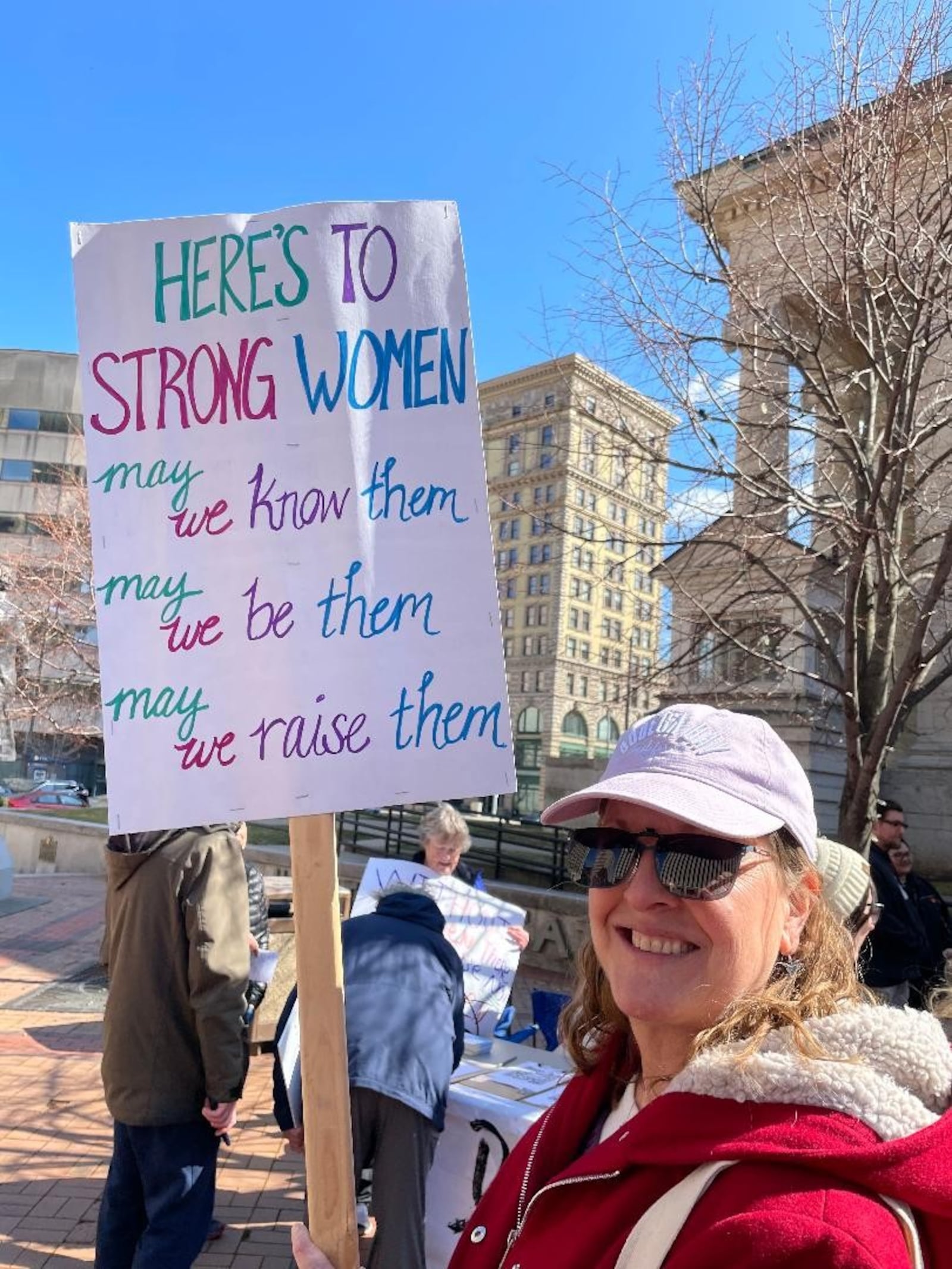 Barb Sayler attends Dayton rally Saturday, March 8 in celebration of International Women's Day. Photo by Russell Florence Jr.