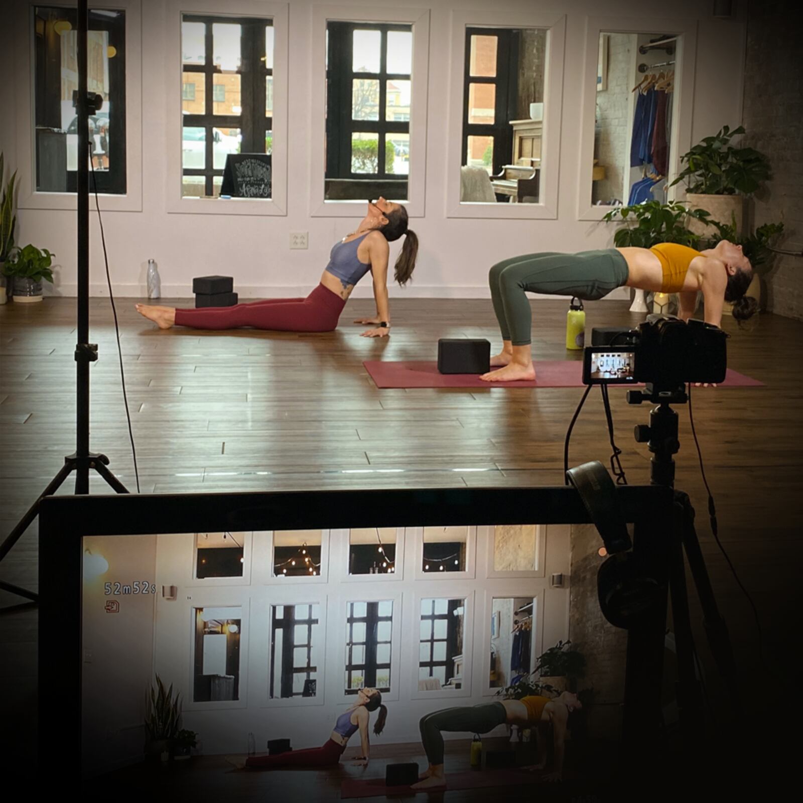 Speakeasy Yoga teacher Tori Reynolds, left, and Natalia Calzada (also featuring studio dogs Bruce and Harvey) livestreaming a yoga class. The business, like others, is connecting to customers via video streaming and the web to maintain business in an era of social distancing and business lock-downs. CONTRIBUTED/SPEAKEASY YOGA