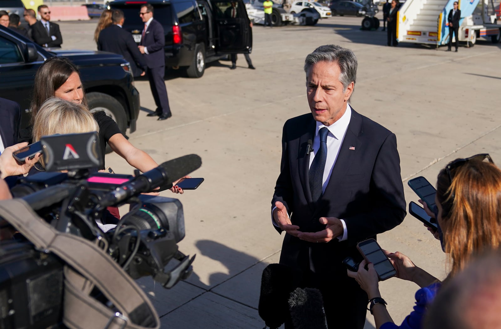 U.S. Secretary of State Antony Blinken speaks with members of the media at Ben Gurion International Airport before departing for Riyadh, Saudi Arabia, in Tel Aviv, Israel Wednesday, Oct. 23, 2024. (Nathan Howard/Pool Photo via AP)