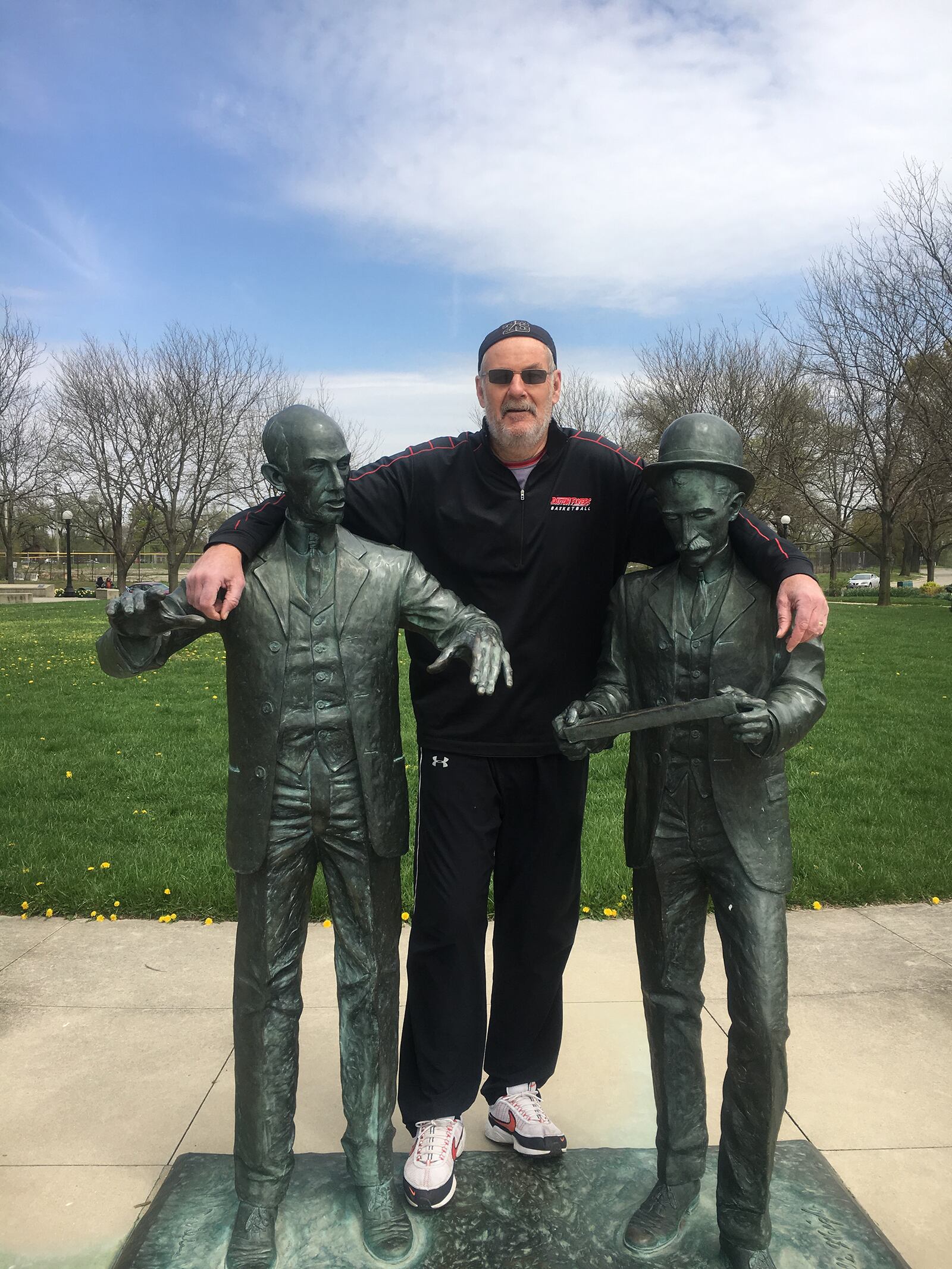 Steve Hess with statues of the Wright Brothers at Deeds Park in Dayton. Deeds Park marked their 10th park and was the first one they documented and shared on social media. CONTRIBUTED