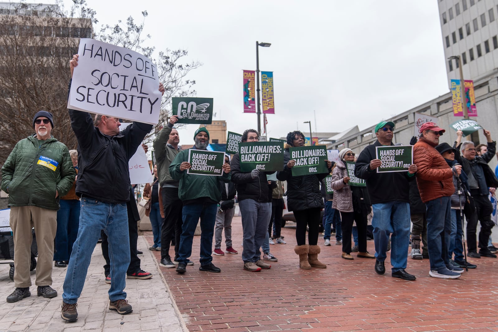 Demonstrators gather outside of the Edward A. Garmatz United States District Courthouse in Baltimore, on Friday, March 14, 2025, before a hearing regarding the Department of Government Efficiency's access to Social Security data. (AP Photo/Stephanie Scarbrough)