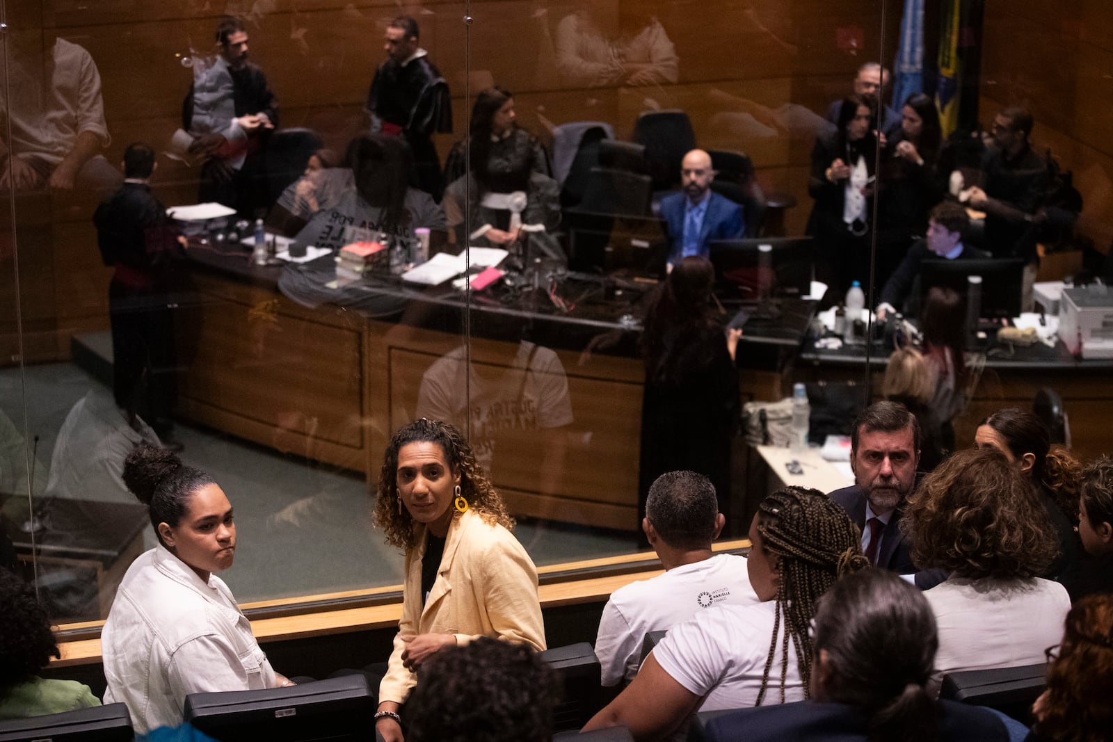 Luyara Santos, from left, and Minister of Racial Equality Anielle Franco, the daughter, and sister of slain councilwoman Marielle Franco, attend the trial of Franco's suspected murderers, at the Court of Justice in Rio de Janeiro, Wednesday, Oct. 30, 2024. (AP Photo/Bruna Prado)