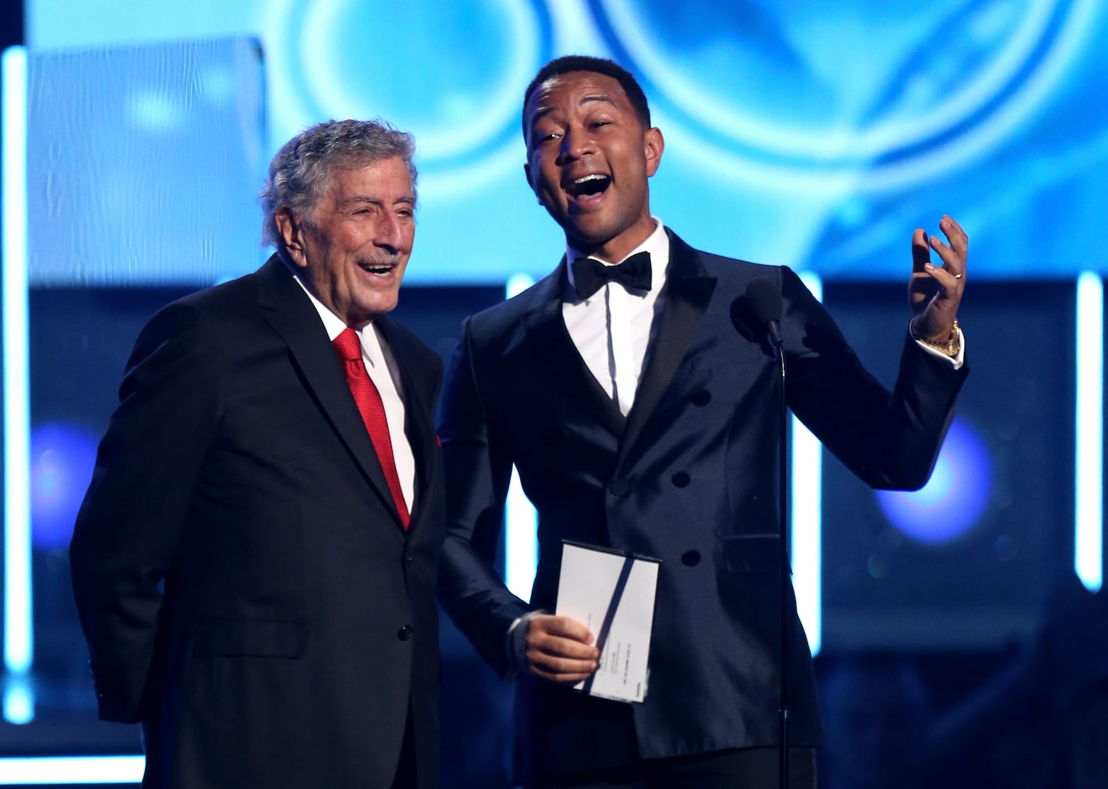 Tony Bennett, left, and John Legend present the award for best rap/sung performance at the 60th annual Grammy Awards at Madison Square Garden on Sunday, Jan. 28, 2018, in New York. (Photo by Matt Sayles/Invision/AP)