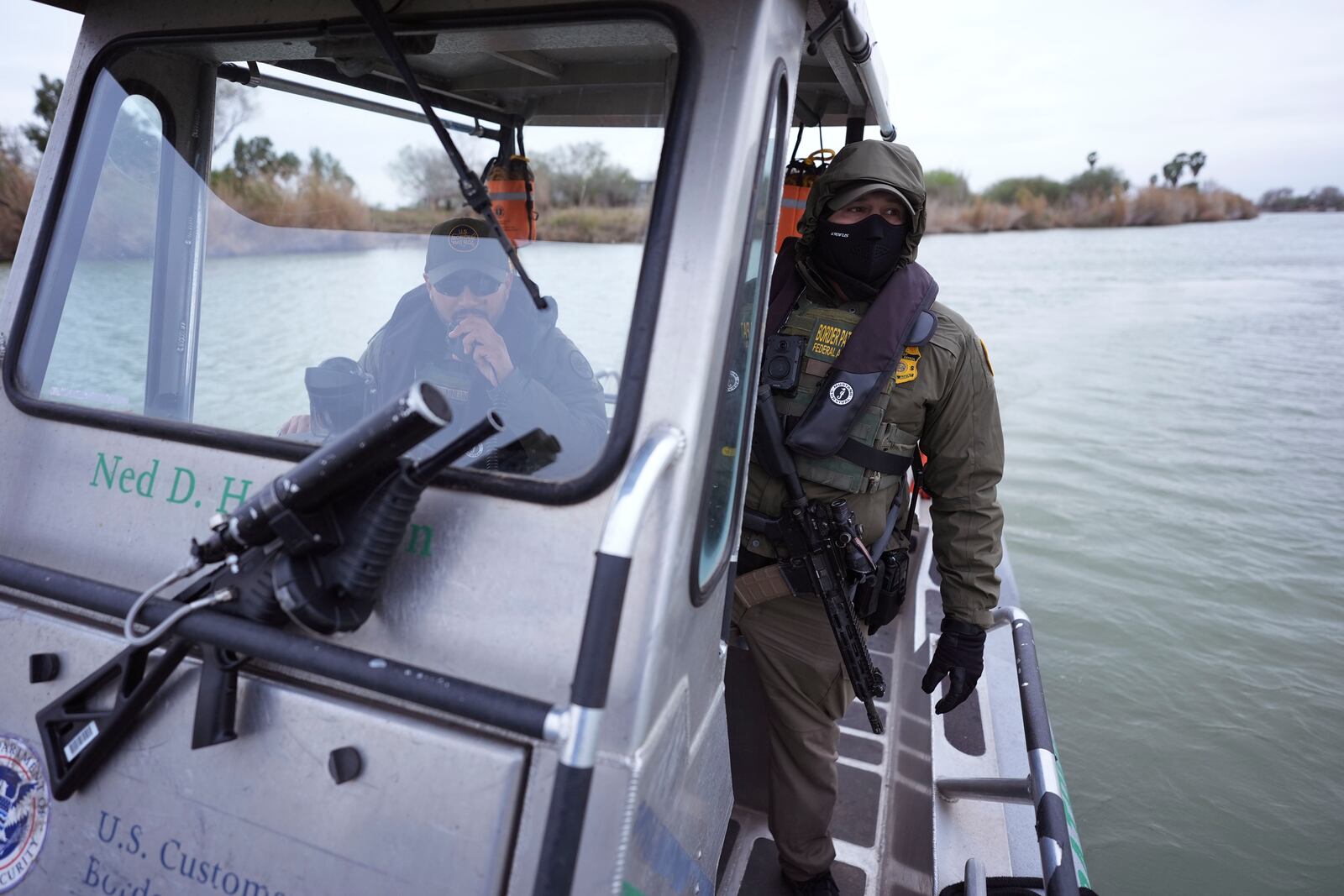 Border patrol agents patrol along the Rio Grande at the U.S.-Texas border, Thursday, Feb. 13, 2025, in McAllen, Texas. (AP Photo/Eric Gay)