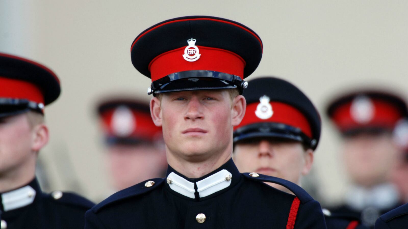 Prince Harry stands to attention at his passing-out Sovereign's Parade at Sandhurst Military Academy on April 12, 2006 in Sandhurst, England.