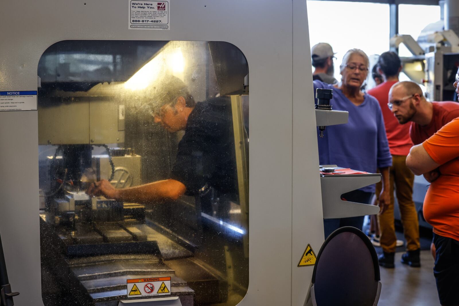 Adam Dixon, left, works in a welding/fabrication shop in Dayton and wants to move up in his shop by taking advanced manufacturing classes at Sinclair Community College.  JIM NOELKER/STAFF