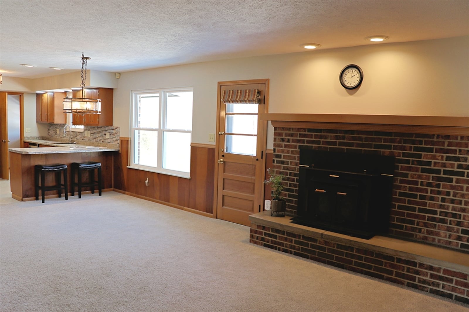 The residence features three wood-burning fireplaces.