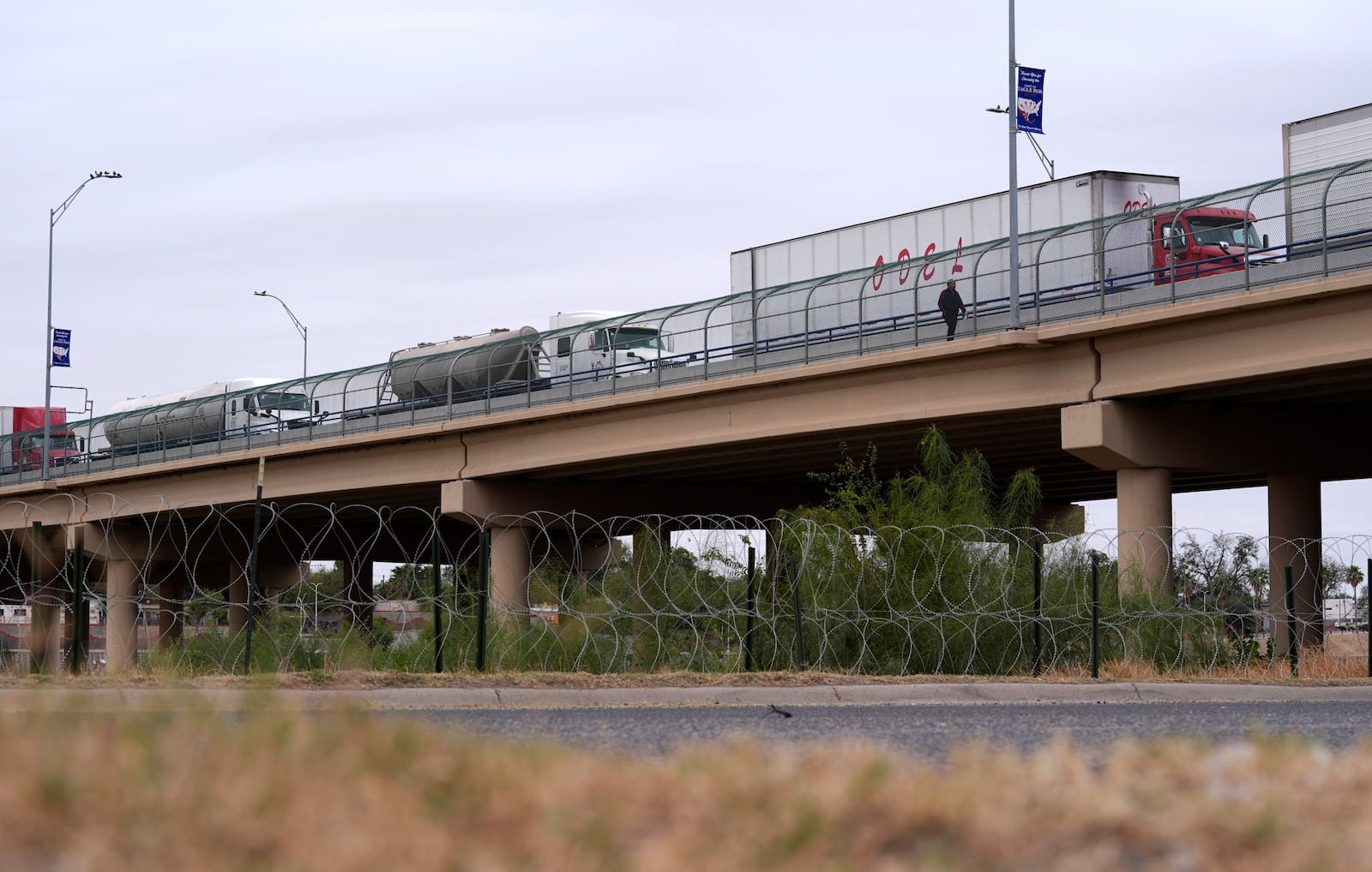 Trucks cross the International Bridge from Mexico into the United States, Tuesday, Nov. 26, 2024, in Eagle Pass, Texas. (AP Photo/Eric Gay)