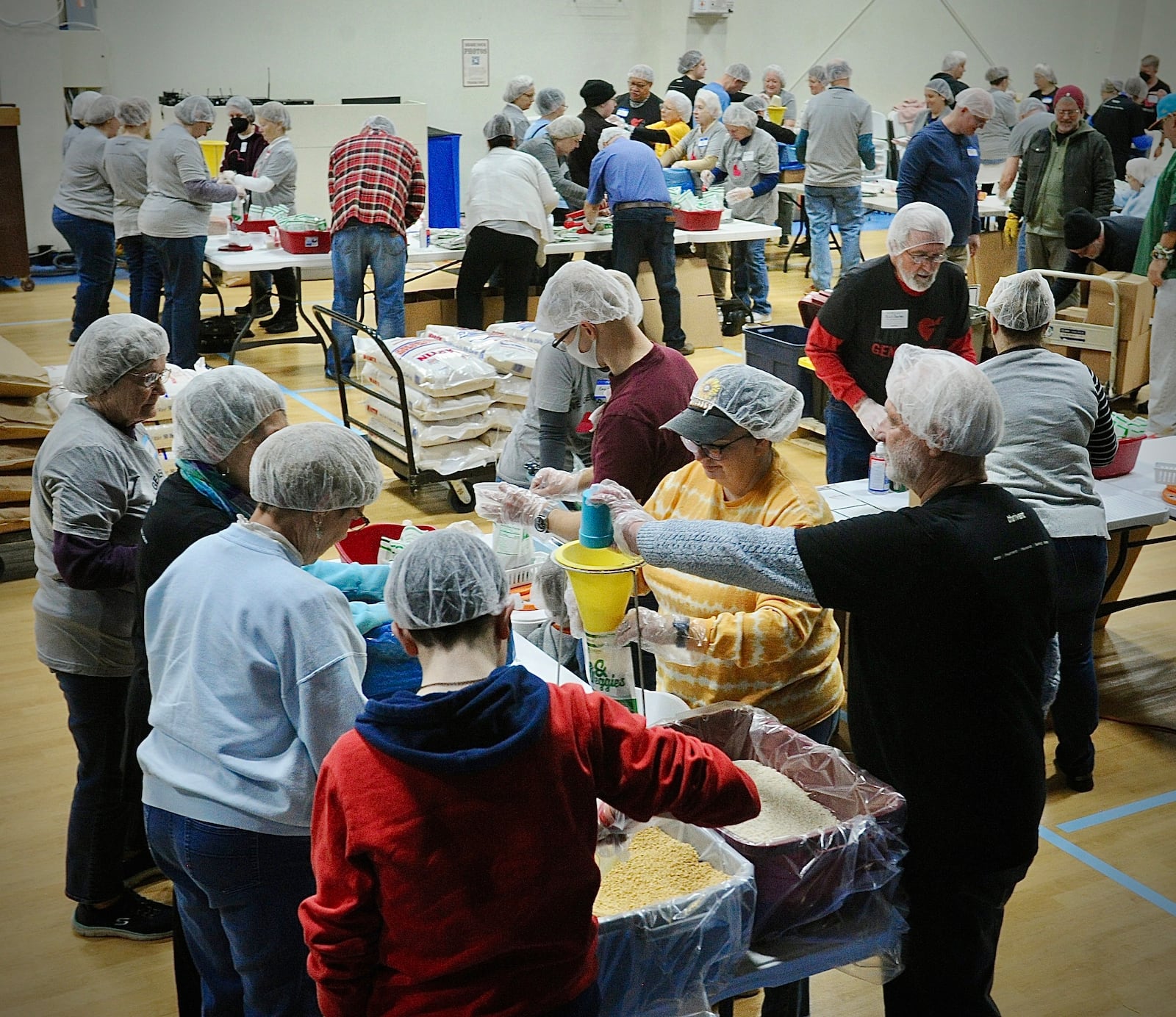 Over 140 volunteers from ages of 3 to 85 years old, packed over 35,640 meals Saturday, Jan. 20, 2024 for third world countries at the Abiding Christ Church in Fairborn. MARSHALL GORBY\STAFF