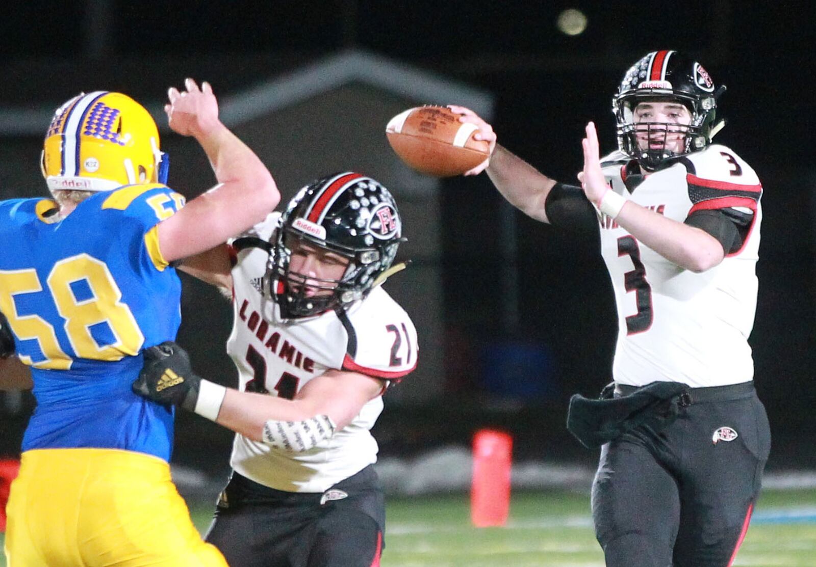 Fort Loramie QB Collin Moore delivers. Marion Local defeated Fort Loramie 24-21 in OT in a Division VII, Region 28 high school football regional semifinal at St. Marys Memorial on Saturday, Nov. 16, 2019. MARC PENDLETON / STAFF