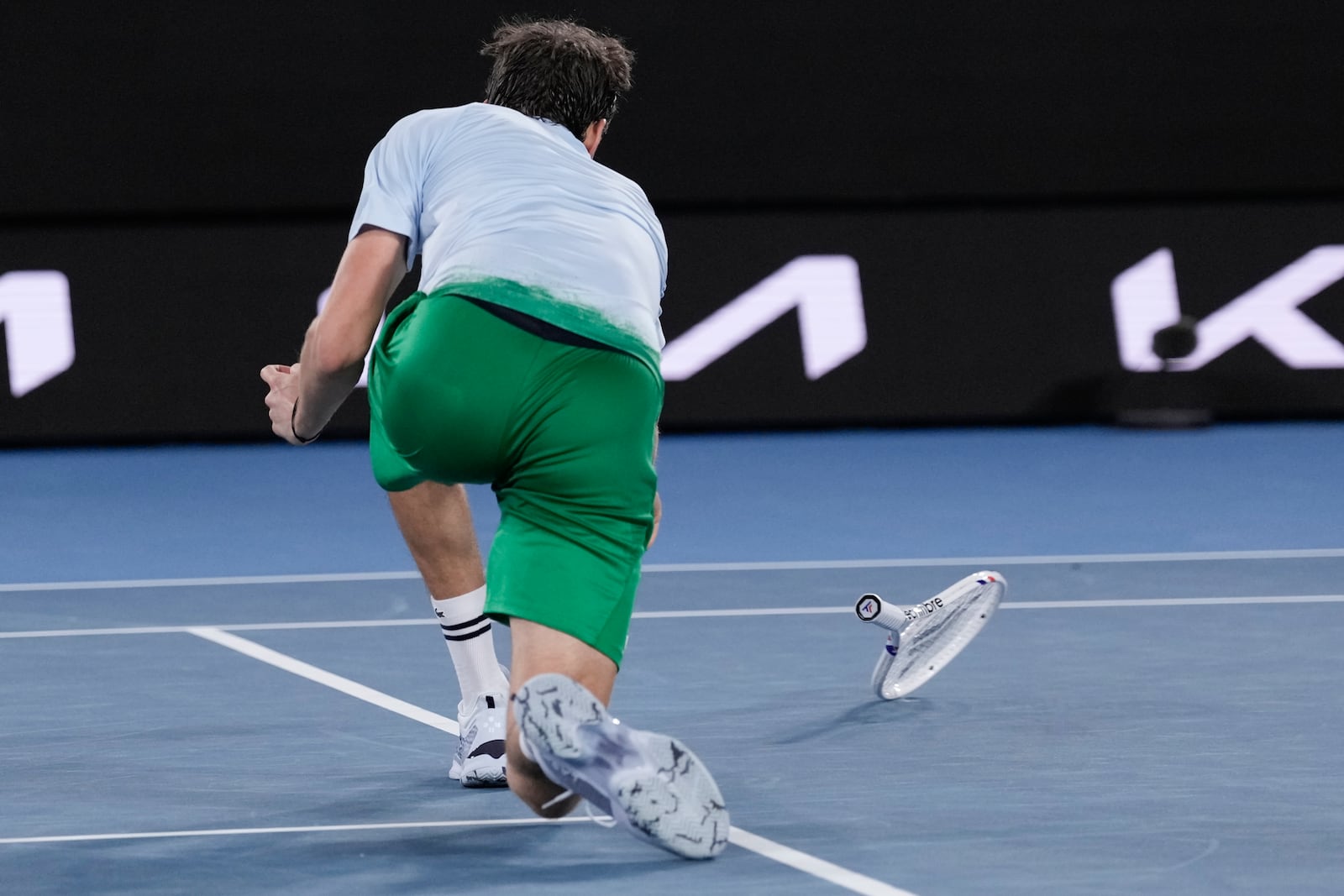 Daniil Medvedev of Russia throws his racker during his second round match against Learner Tien of the U.S. at the Australian Open tennis championship in Melbourne, Australia, Thursday, Jan. 16, 2025. (AP Photo/Ng Han Guan)