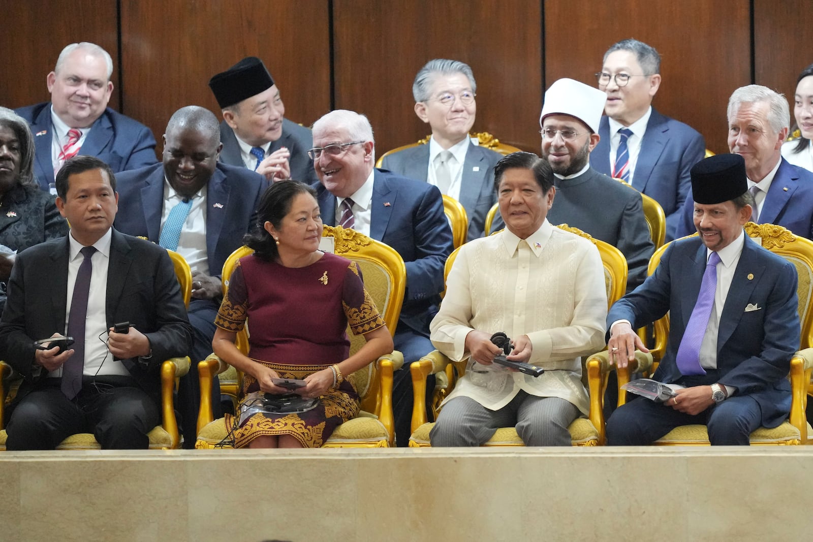 From left, Cambodia's Prime Minister Hun Manet, Louise Marcos, the wife of Philippine's President Ferdinand Marcos Jr., Philippine's President Ferdinand Marcos Jr., and Brunei Sultan Hassanal Bolkiah attend the swearing in ceremony of Indonesia's new President Prabowo Subianto at the parliament building in Jakarta, Indonesia, Sunday, Oct. 20, 2024. (AP Photo/Tatan Syuflana)