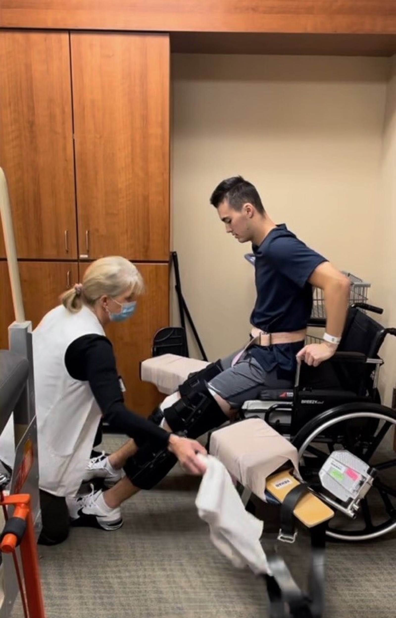 Riley Blankenship gets some help from a nurse’s aide at Atrium Medical Center. CONTRIBUTED