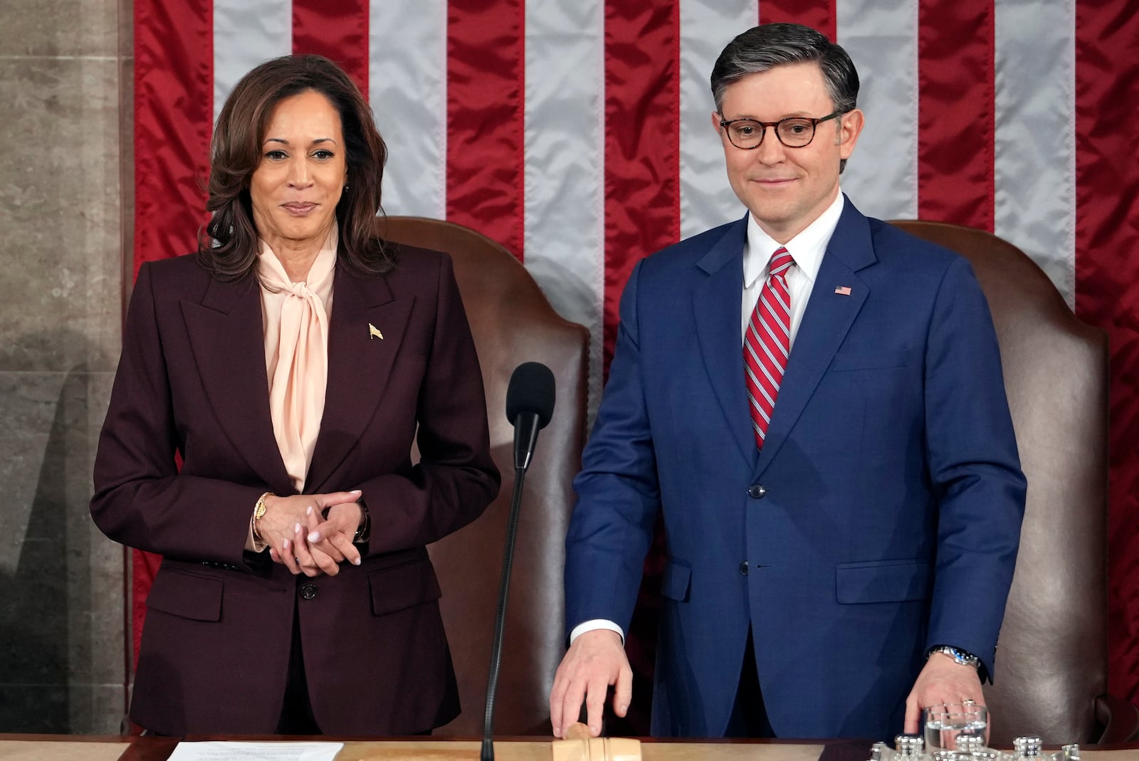 Vice President Kamala Harris stands with House Speaker Mike Johnson of La., as a joint session of Congress convenes to confirm the Electoral College votes, affirming President-elect Donald Trump's victory in the presidential election, Monday, Jan. 6, 2025, at the U.S. Capitol in Washington. (AP Photo/Matt Rourke)