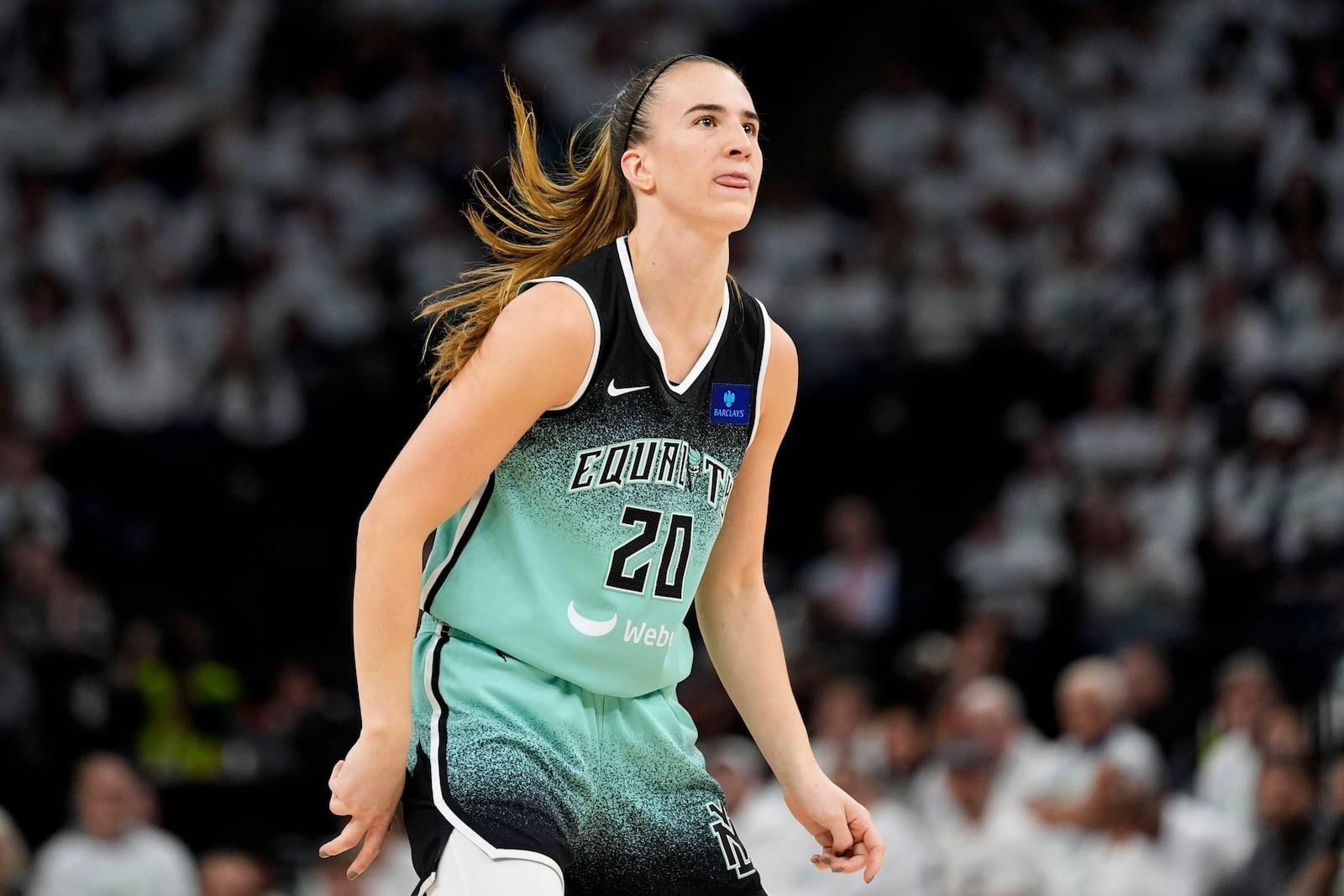 New York Liberty guard Sabrina Ionescu reacts after missing a shot during the first half against the Minnesota Lynx in Game 3 of a WNBA basketball final playoff series, Wednesday, Oct. 16, 2024, in Minneapolis. (AP Photo/Abbie Parr)