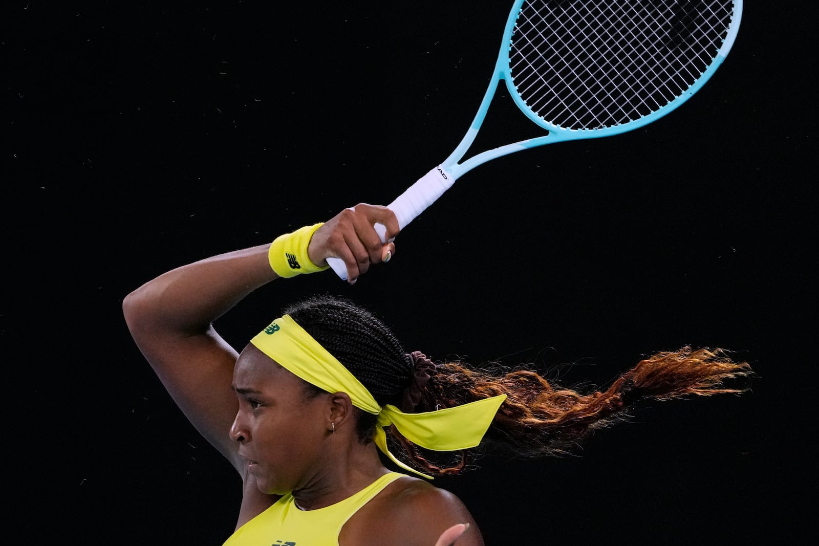 Coco Gauff of the U.S. plays a forehand return to Jodie Burrage of Britain during their second round match at the Australian Open tennis championship in Melbourne, Australia, Wednesday, Jan. 15, 2025. (AP Photo/Vincent Thian)